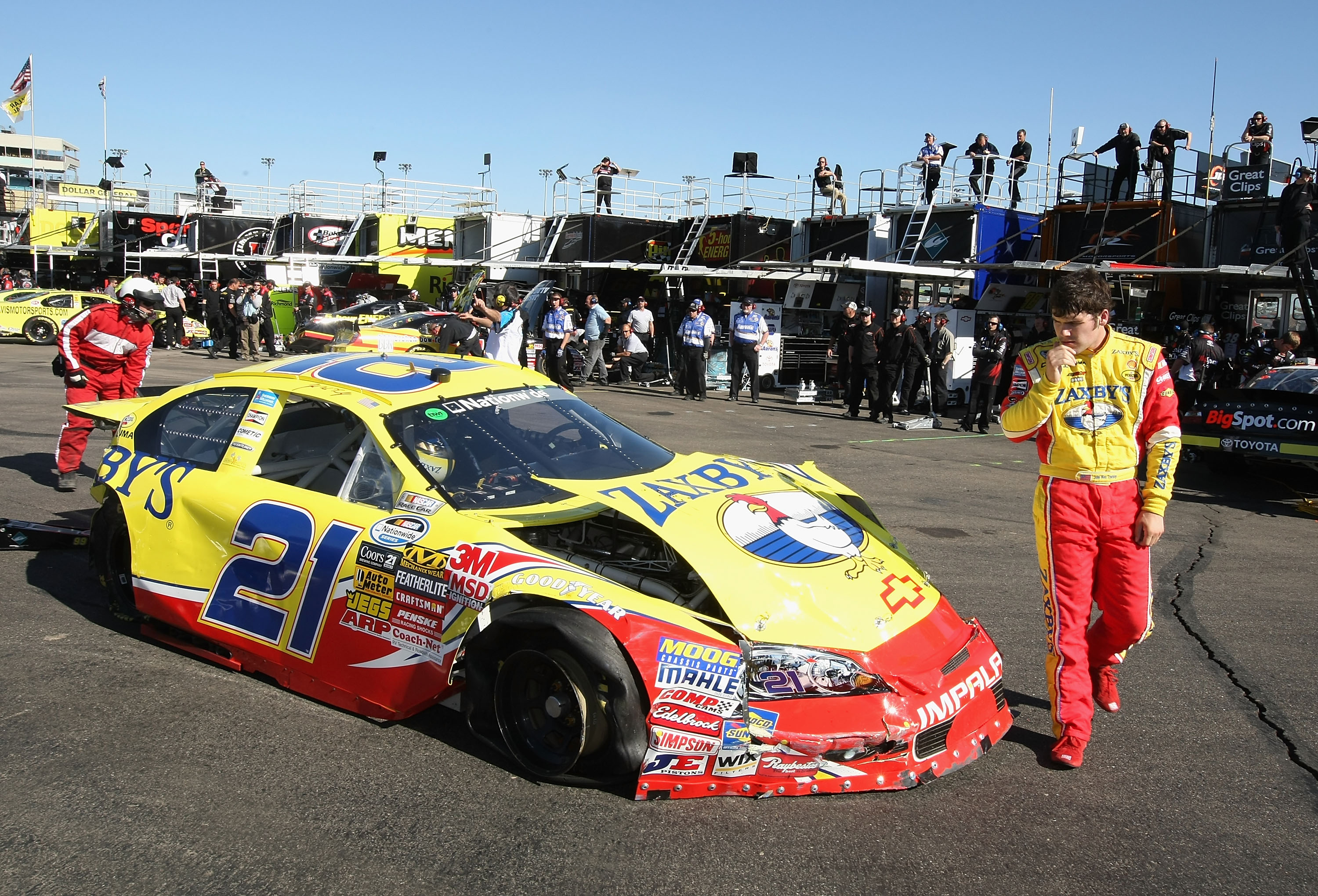 PHOENIX - APRIL 09:  John Wes Townley, driver of the #21 Zaxby's Chevrolet, looks at his car after a crash during practice for the NASCAR Nationwide Series Bashas' Supermarkets 200 at Phoenix International Raceway on April 9, 2010 in Phoenix, Arizona.  (P