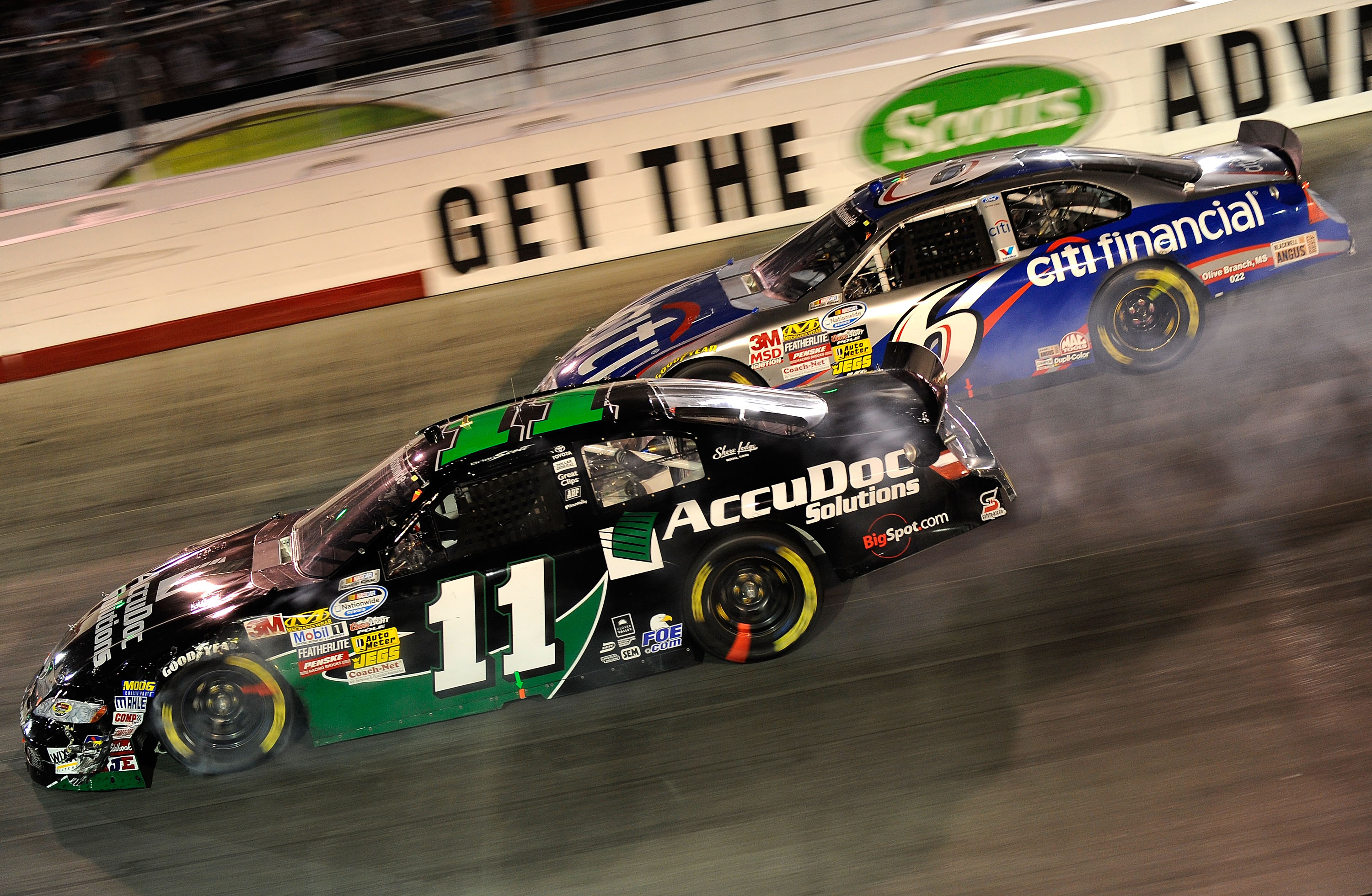 BRISTOL, TN - AUGUST 20: Brian Scott, driver of the #11 AccuDoc Solutions Toyota, and Ricky Stenhouse Jr., driver of the #6 CitiFinancial Ford, drive during the NASCAR Nationwide Series Food City 250 at Bristol Motor Speedway on August 20, 2010 in Bristo