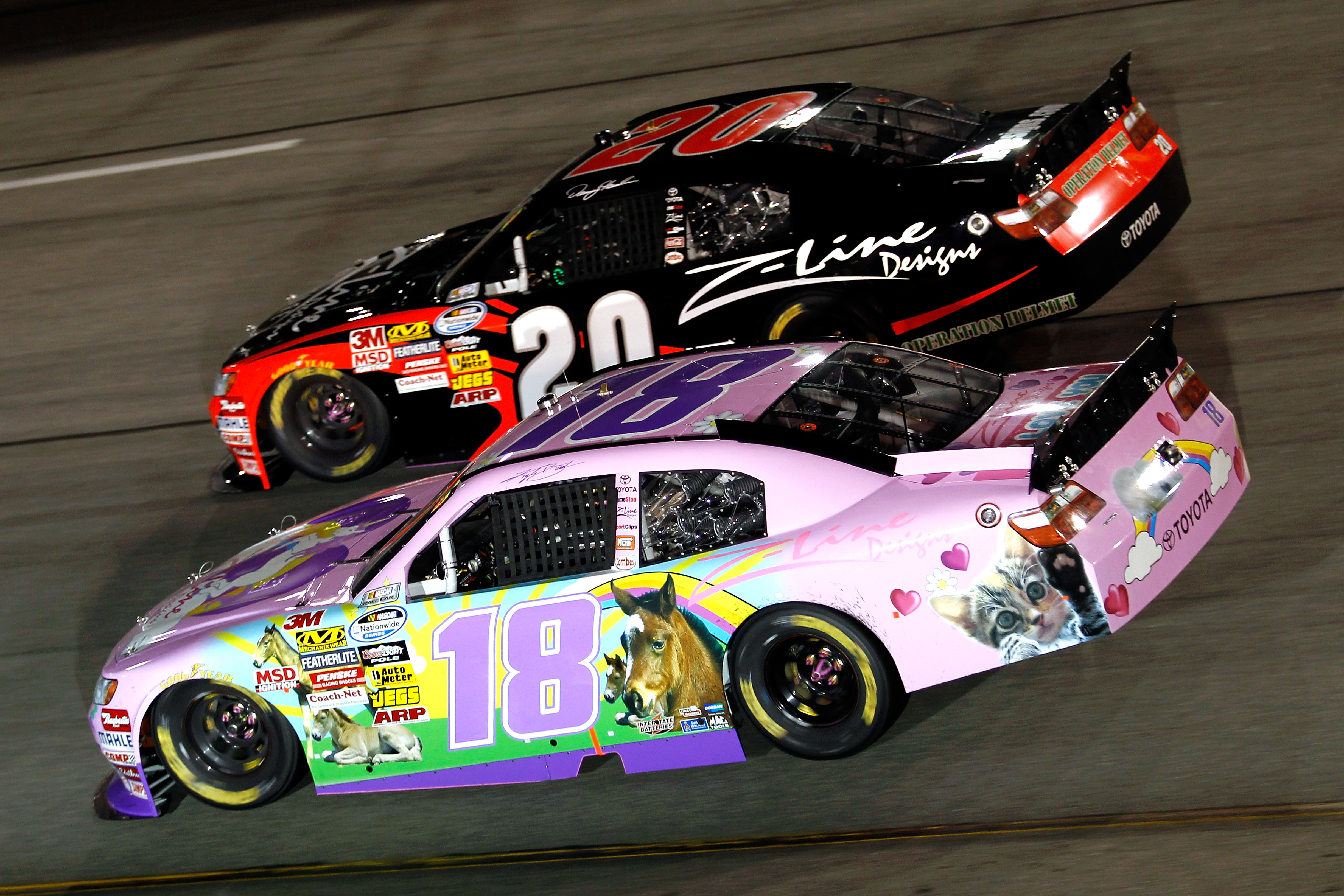 RICHMOND, VA - SEPTEMBER 10: Kyle Busch, driver of the #18 Toyota Kimmy/Z-Line Designs Toyota, races Joey Logano, driver of the #20 Z-Line Toyota, during the NASCAR Nationwide Series Virginia 529 College Savings 250 at Richmond International Raceway on S