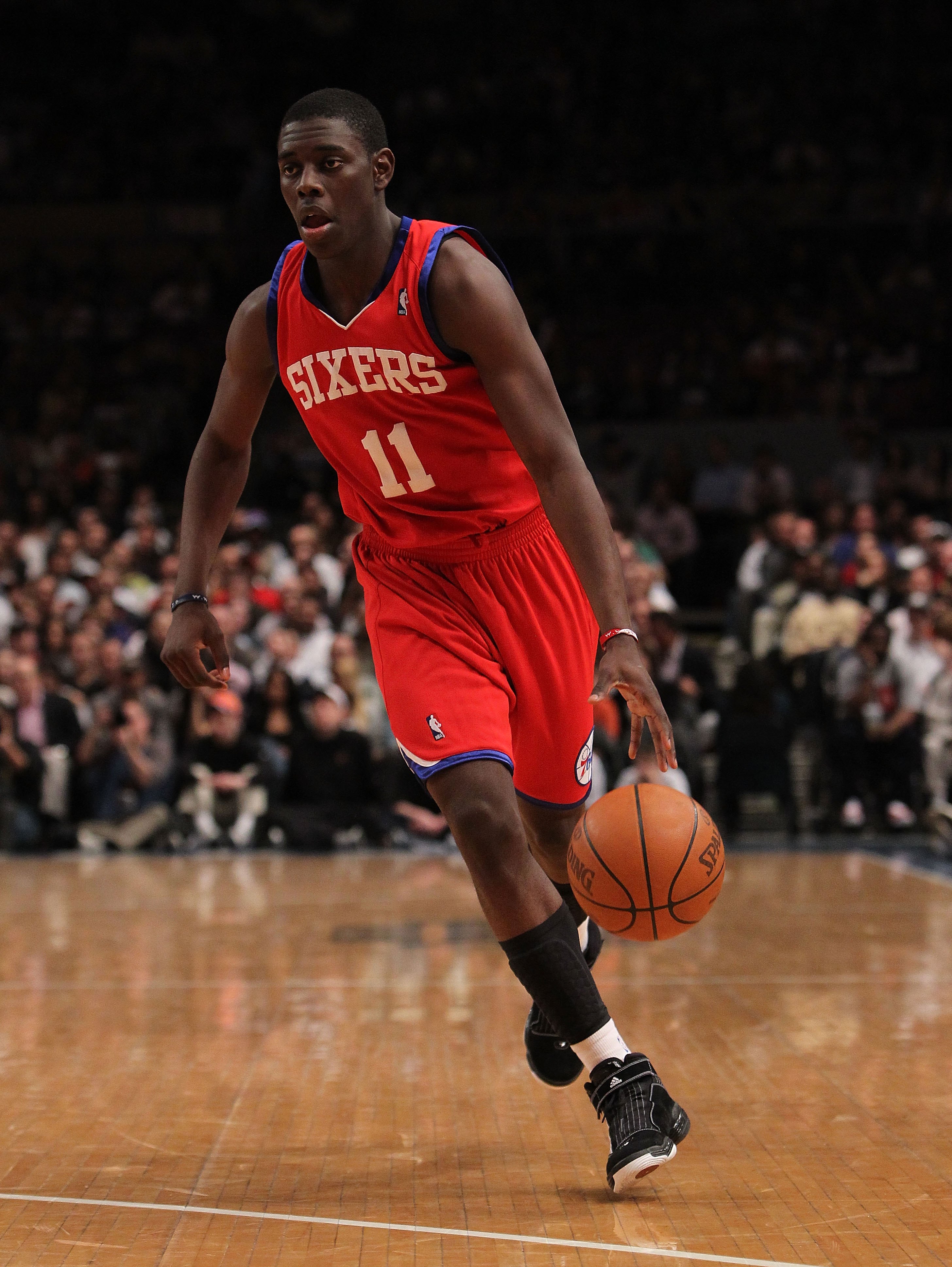 NEW YORK - MARCH 19:  Jrue Holiday #11 of the Philadelphia 76ers dribbles the ball against the New York Knicks at Madison Square Garden on March 19, 2010 in New York City. NOTE TO USER: User expressly acknowledges and agrees that, by downloading and or us