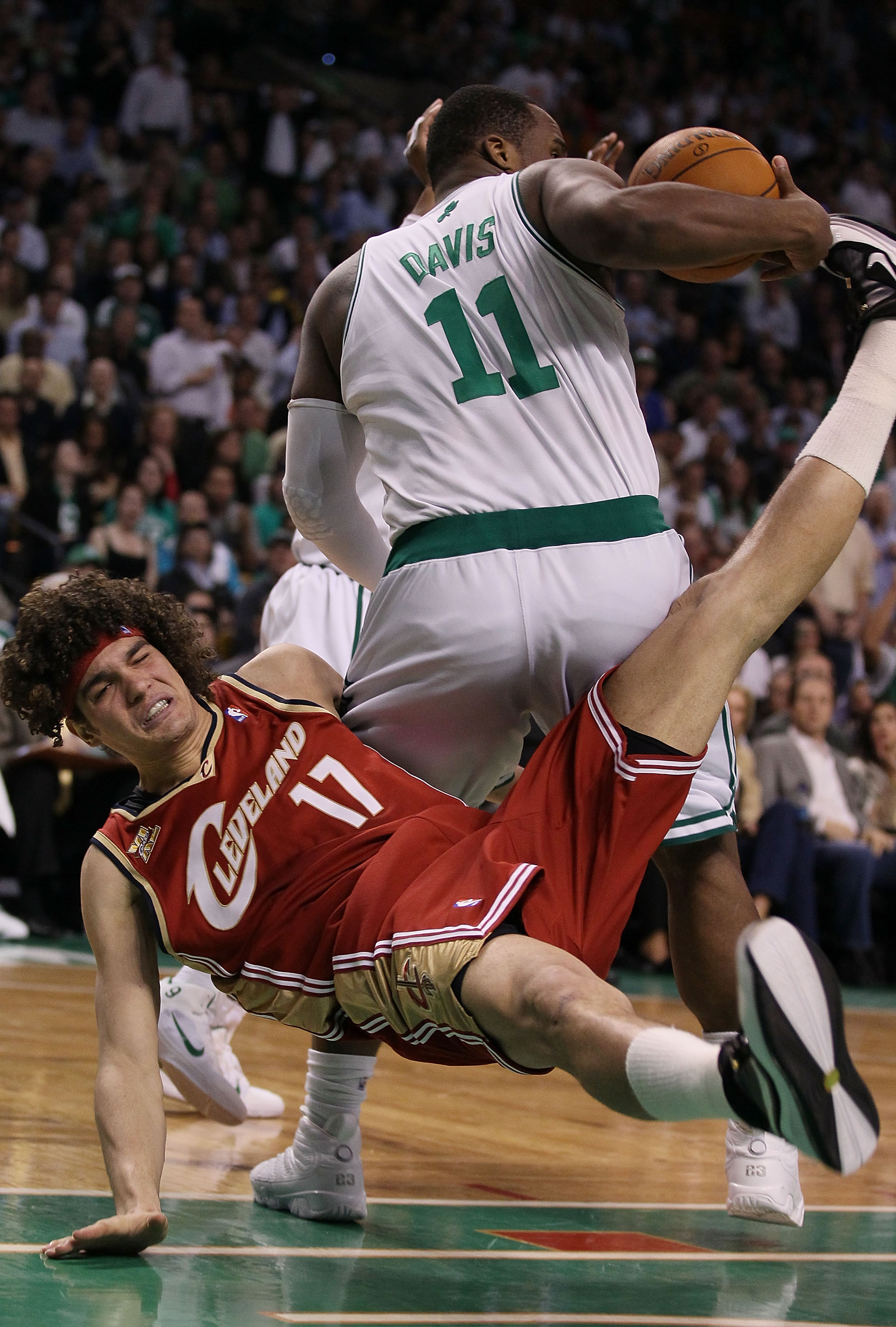 BOSTON - MAY 13:  Glen Davis #11 of the Boston Celtics is called for a loose ball foul on this play as Anderson Varejao #17 of the Cleveland Cavaliers falls to the floor during Game Six of the Eastern Conference Semifinals of the 2010 NBA playoffs at TD G