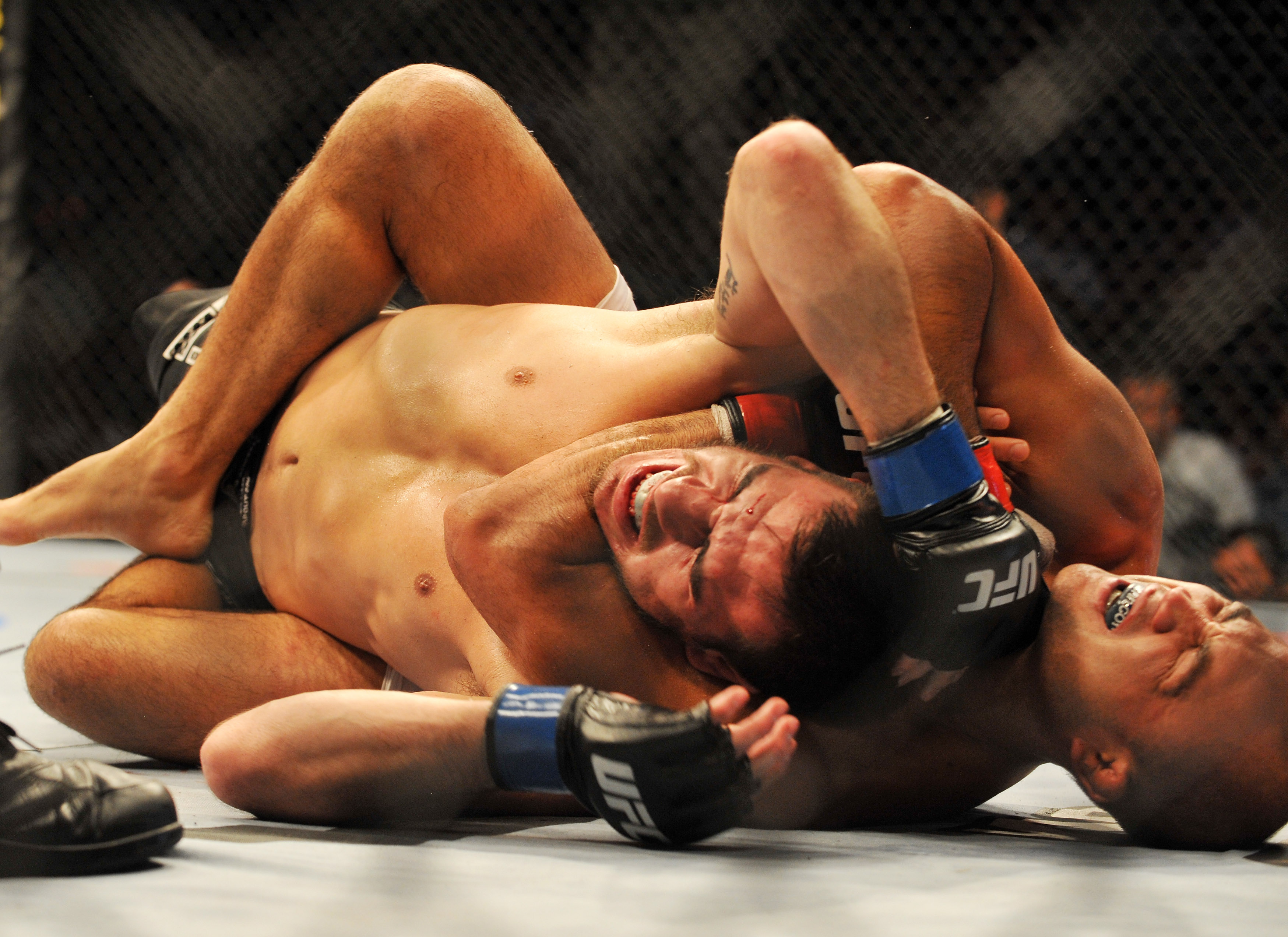 PHILADELPHIA - AUGUST 08: Lightweight champion BJ Penn (R) battles Kenny Florian during their lightweight championship title bout at UFC 101: Declaration at the Wachovia Center on August 8, 2009 in Philadelphia, Pennsylvania. (Photo by Jon Kopaloff/Get
