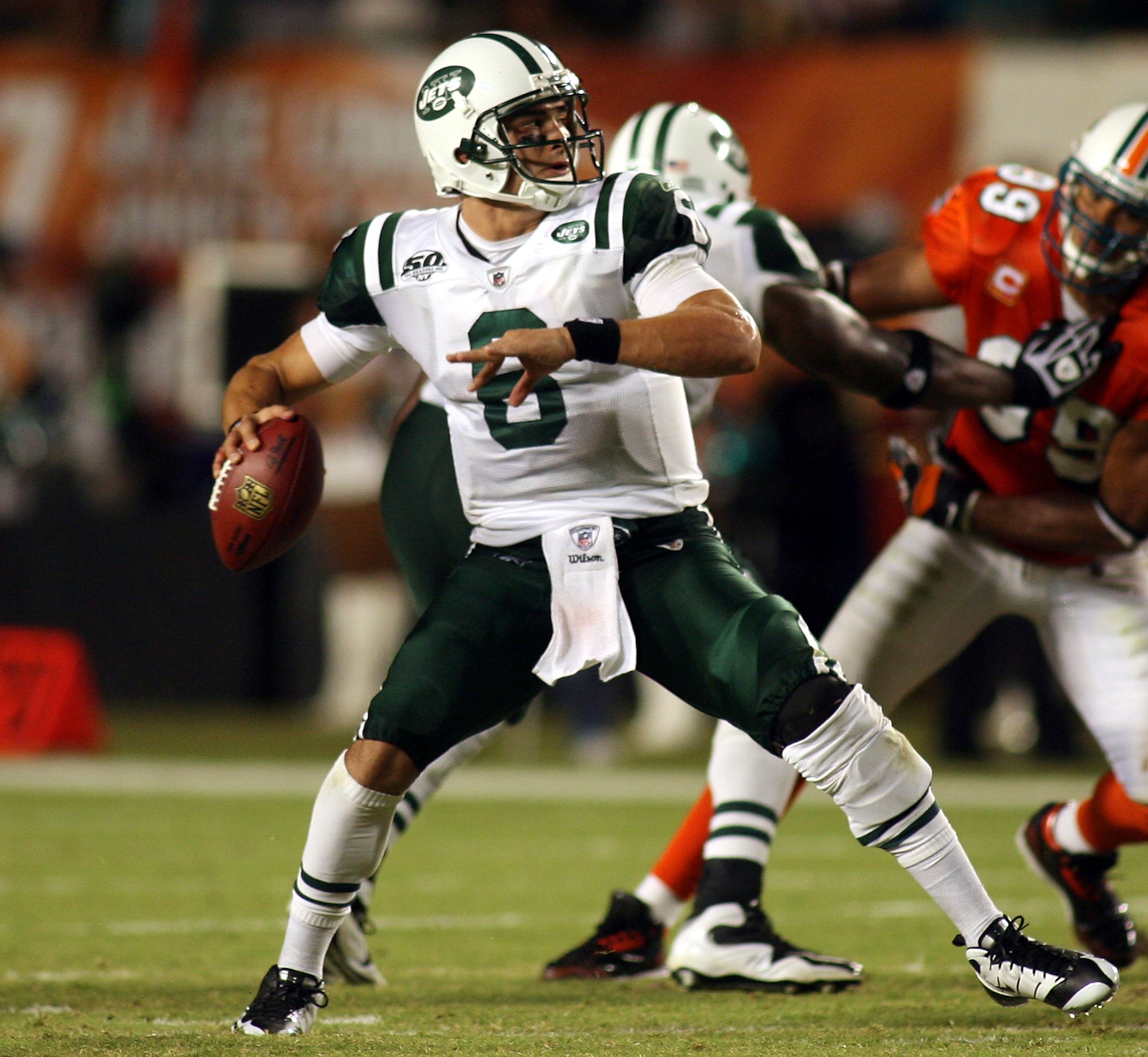 New York Jets quarterback Mark Sanchez (6) scrambles against the