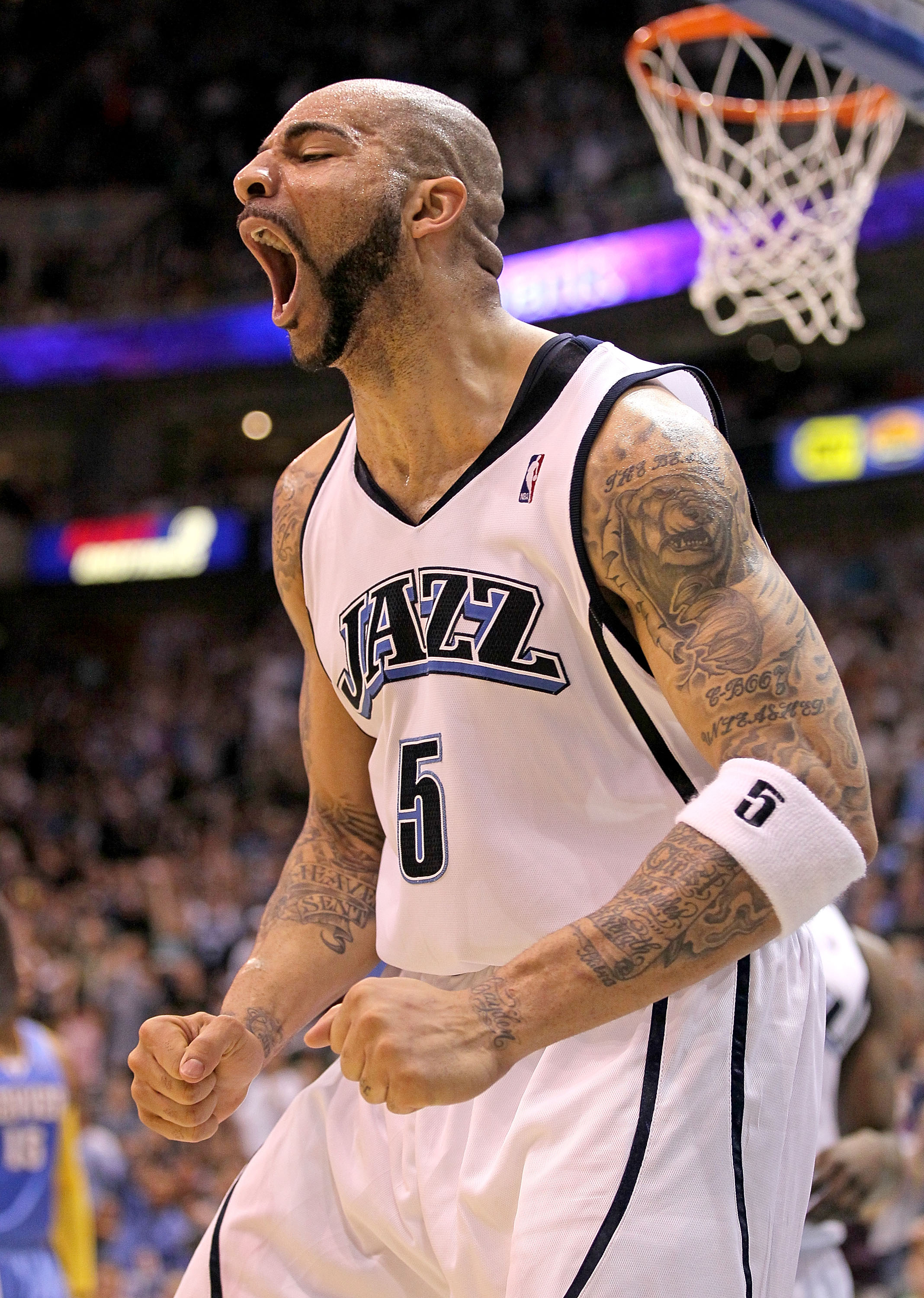 SALT LAKE CITY - APRIL 25:  Carlos Boozer #5 of the Utah Jazz shoots celebrates against the Denver Nuggets during Game Four of the Western Conference Quarterfinals of the 2010 NBA Playoffs at EnergySolutions Arena on April 25, 2010 in Salt Lake City, Utah