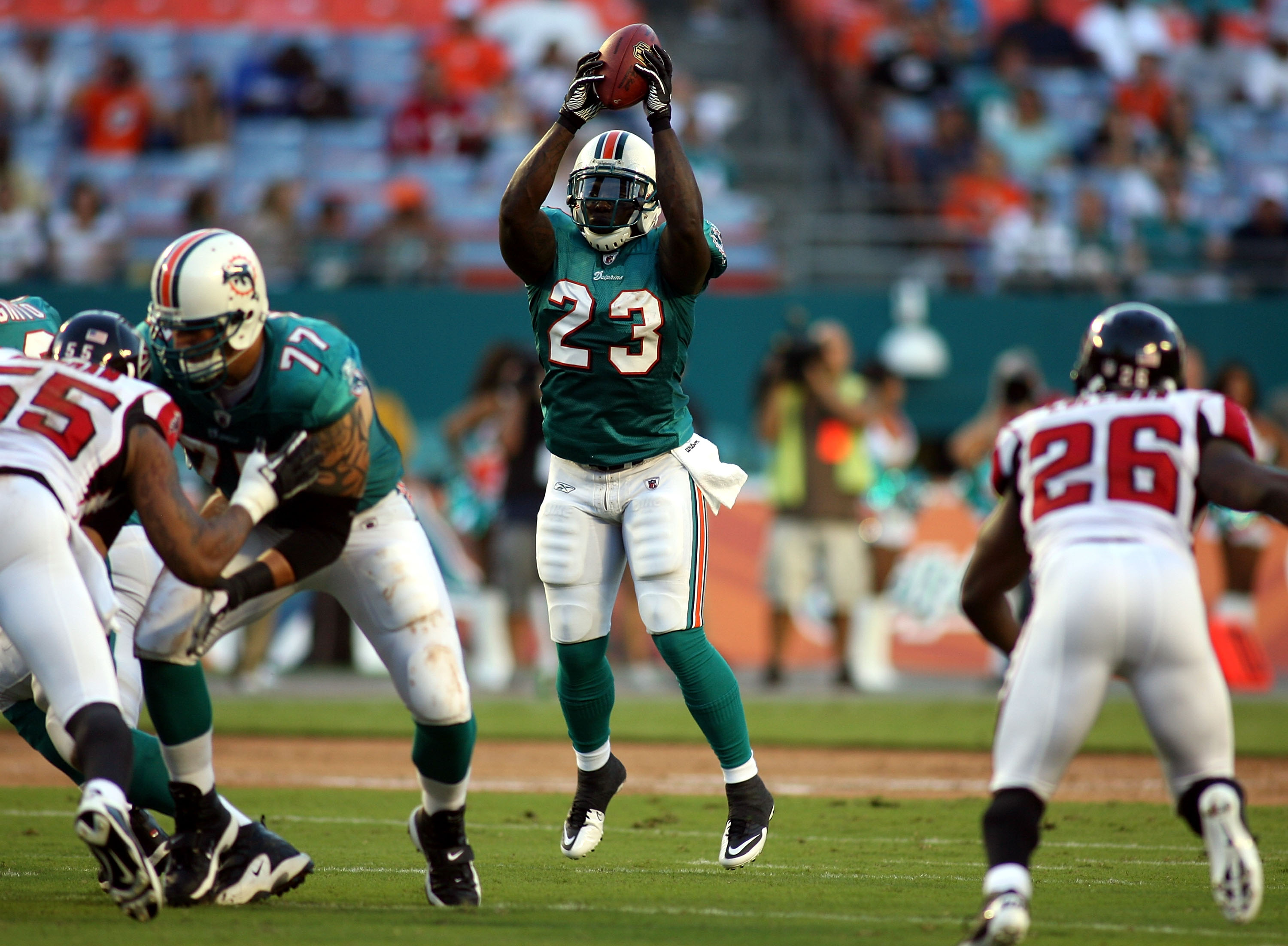 Ronnie Brown of the Miami Dolphins warms up before The Baltimore