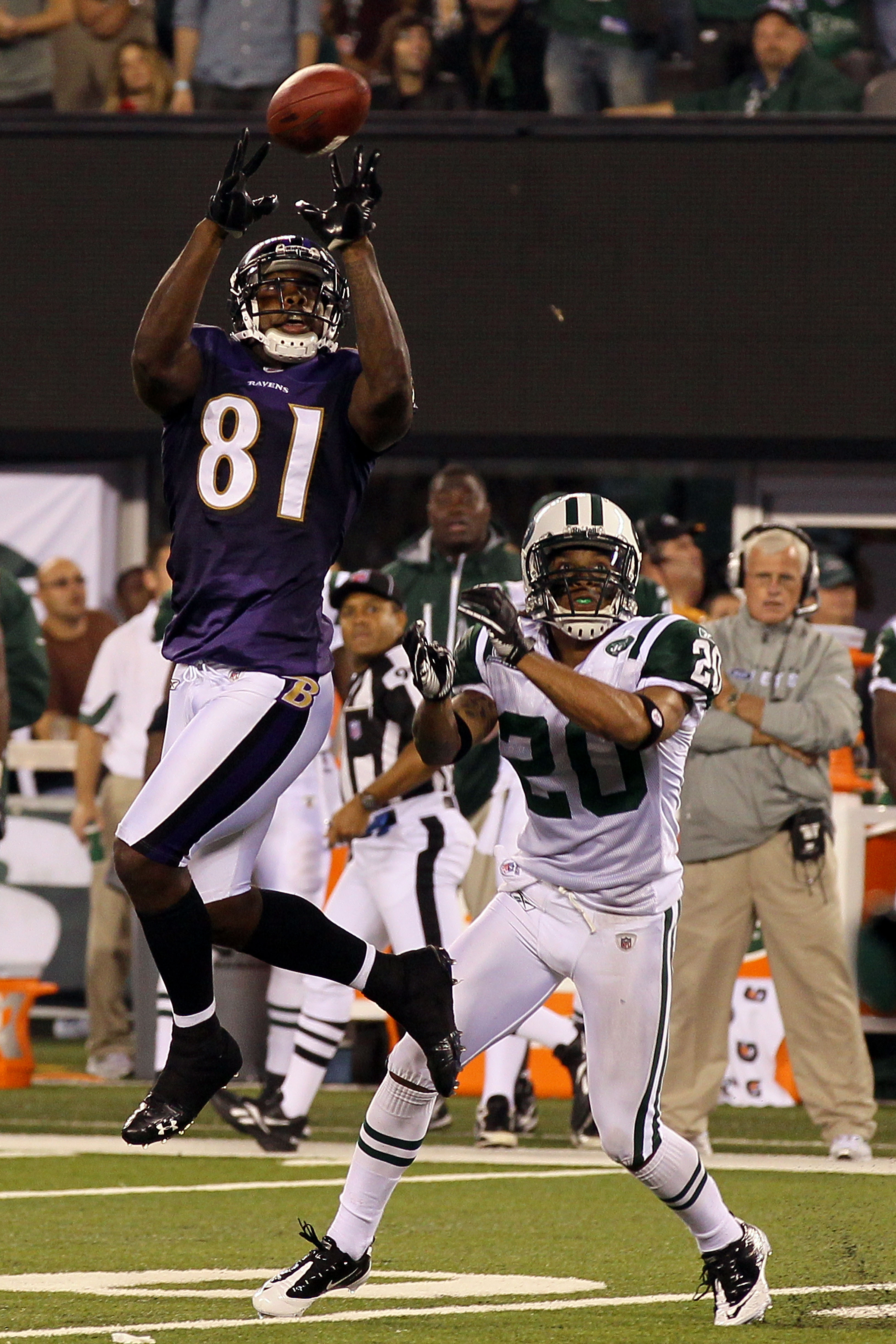 EAST RUTHERFORD, NJ - SEPTEMBER 13:  Anquan Boldin #81 of the Baltimore Ravens catches a pass over Kyle Wilson #20 of the New York Jets during their home opener at the New Meadowlands Stadium on September 13, 2010 in East Rutherford, New Jersey.  (Photo b