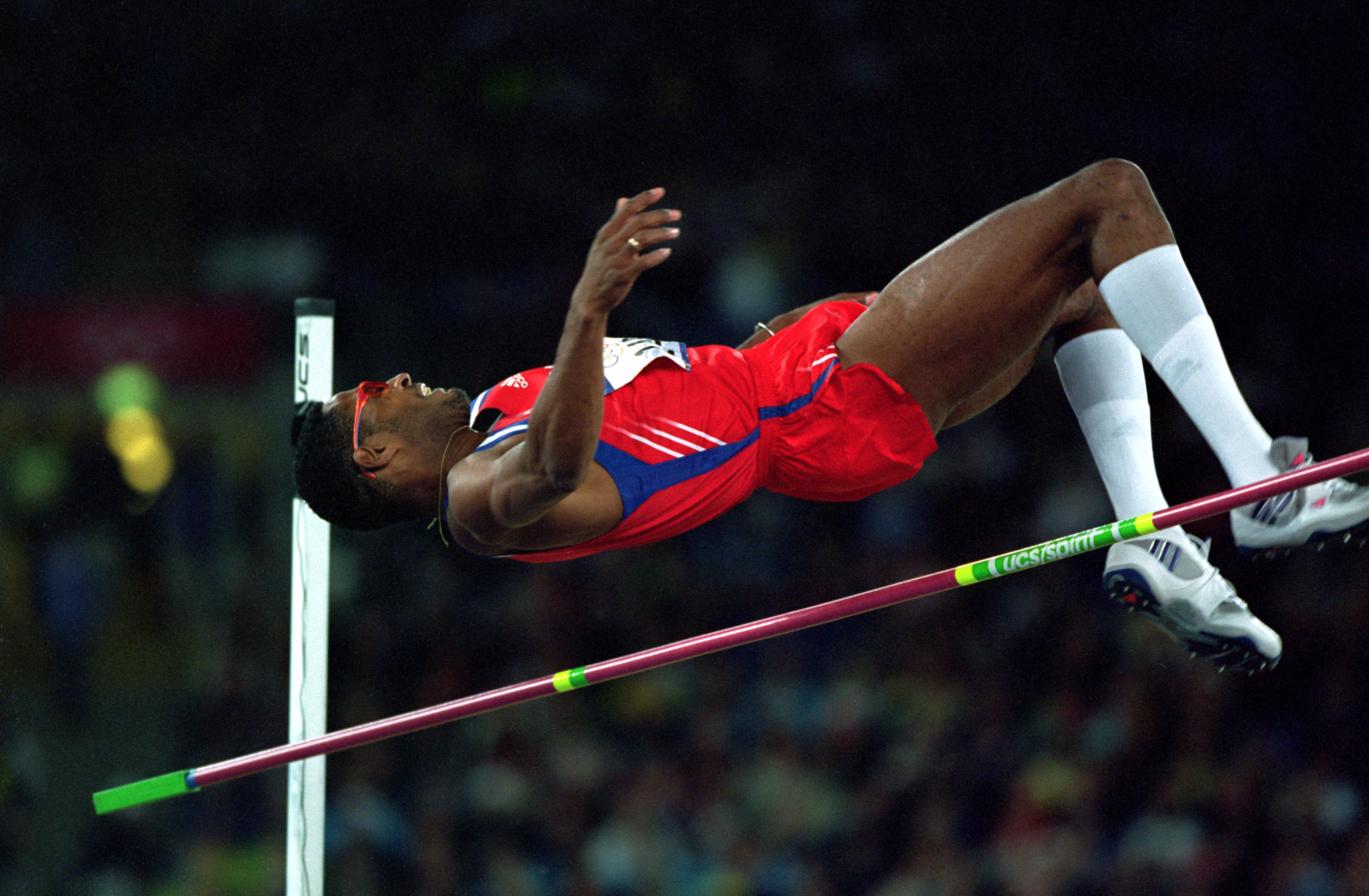 24 Sep 2000:  High jumper Javier Sotomayor of Cuba clears the bar during the Men's High Jump Final at Olympic Stadium in Sydney, Australia during the 2000 Sydney Summer Olympics.  Mandatory Credit:  Mike Powell /Getty Images