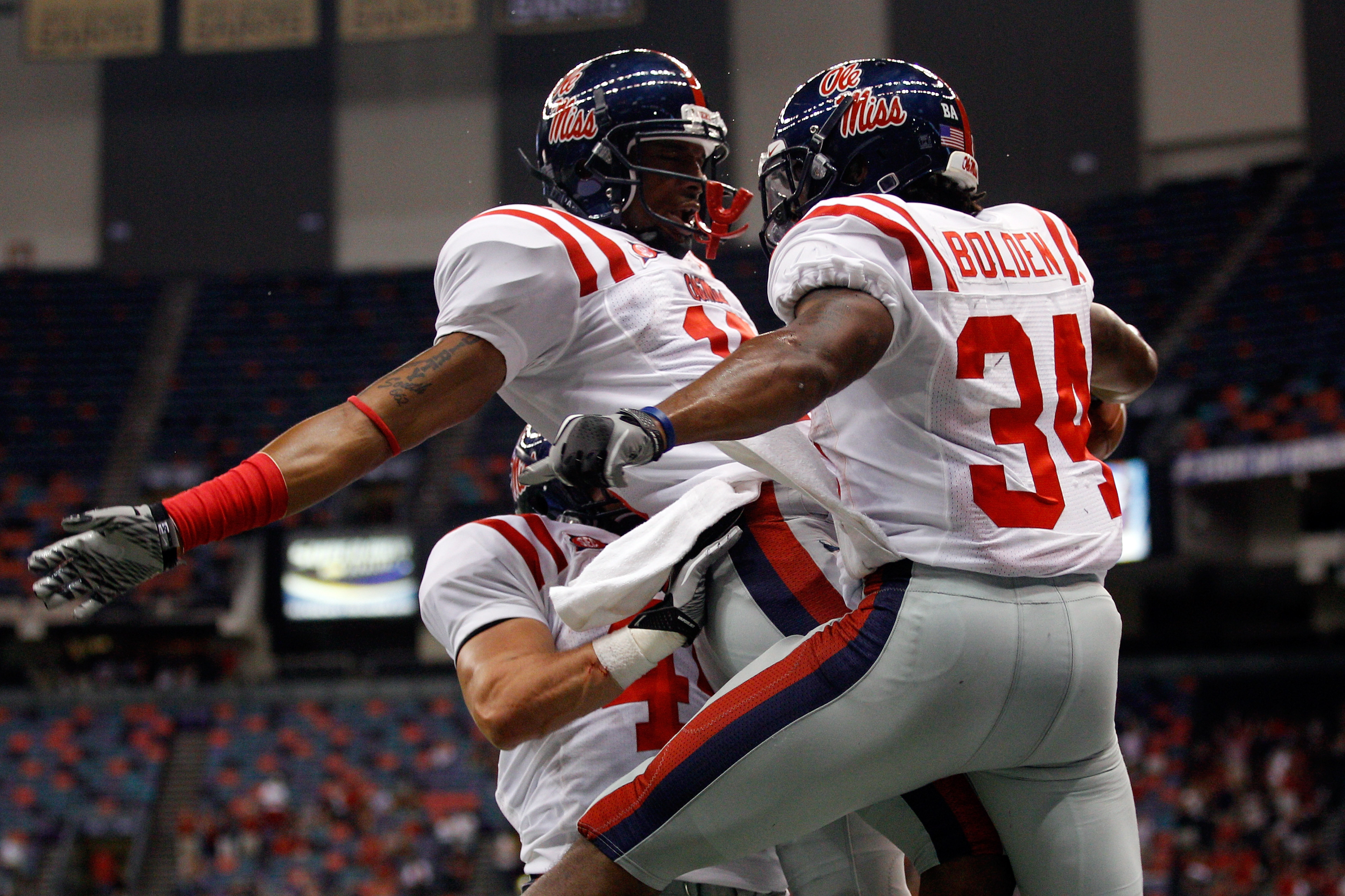 NEW ORLEANS - SEPTEMBER 11: Brandon Bolden #34 celebrates with Markeith Summers #16 of the Ole Miss Rebels after scoring a touchdown against the Tulane Green Wave at the Louisiana Superdome on September 11, 2010 in New Orleans, Louisiana. (Photo by Chri
