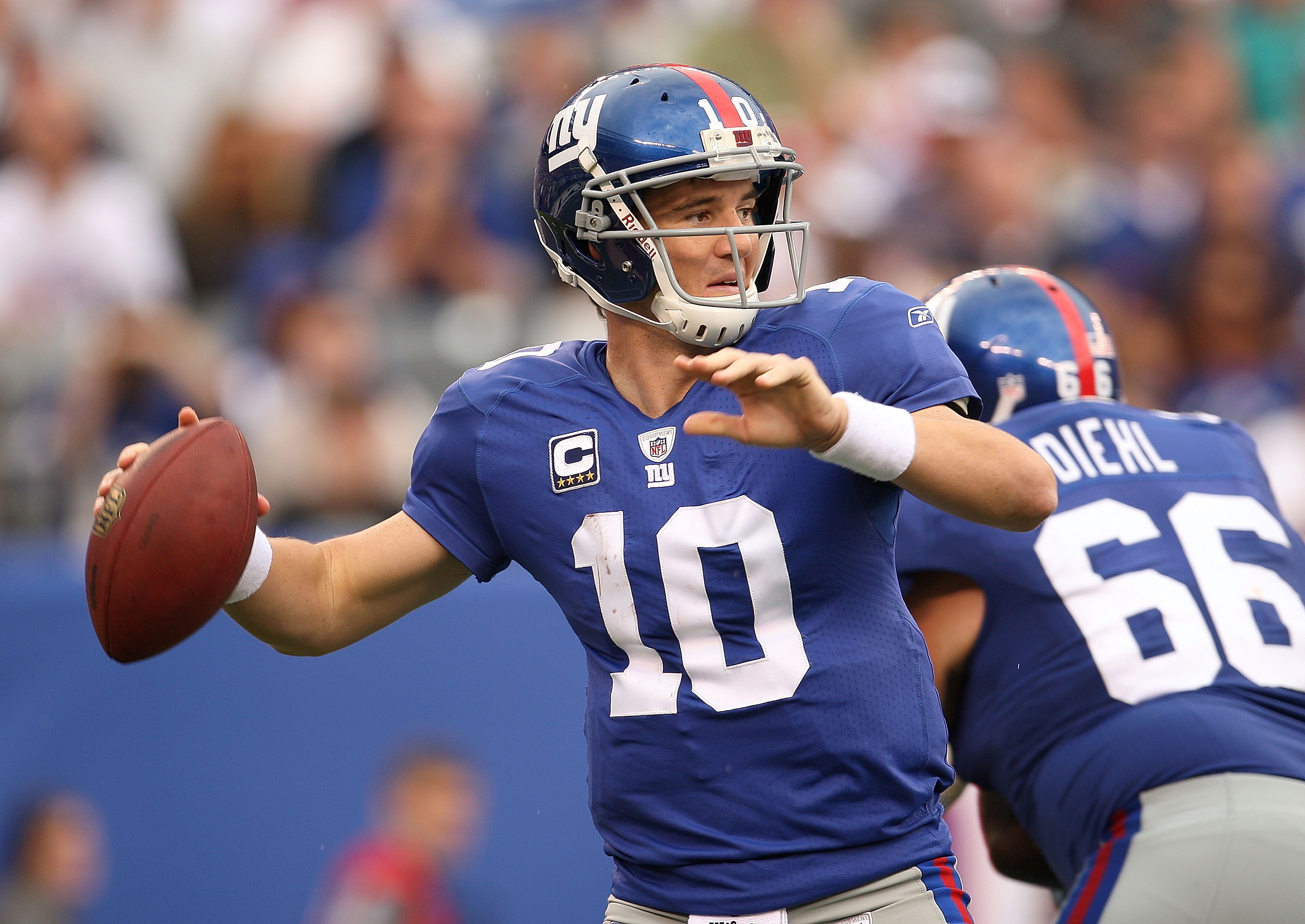 EAST RUTHERFORD, NJ - SEPTEMBER 26:  Eli Manning #10 of the New York Giants passes during a game against the Tennessee Titans at New Meadowlands Stadium on September 26, 2010 in East Rutherford, New Jersey.  (Photo by Mike Ehrmann/Getty Images)