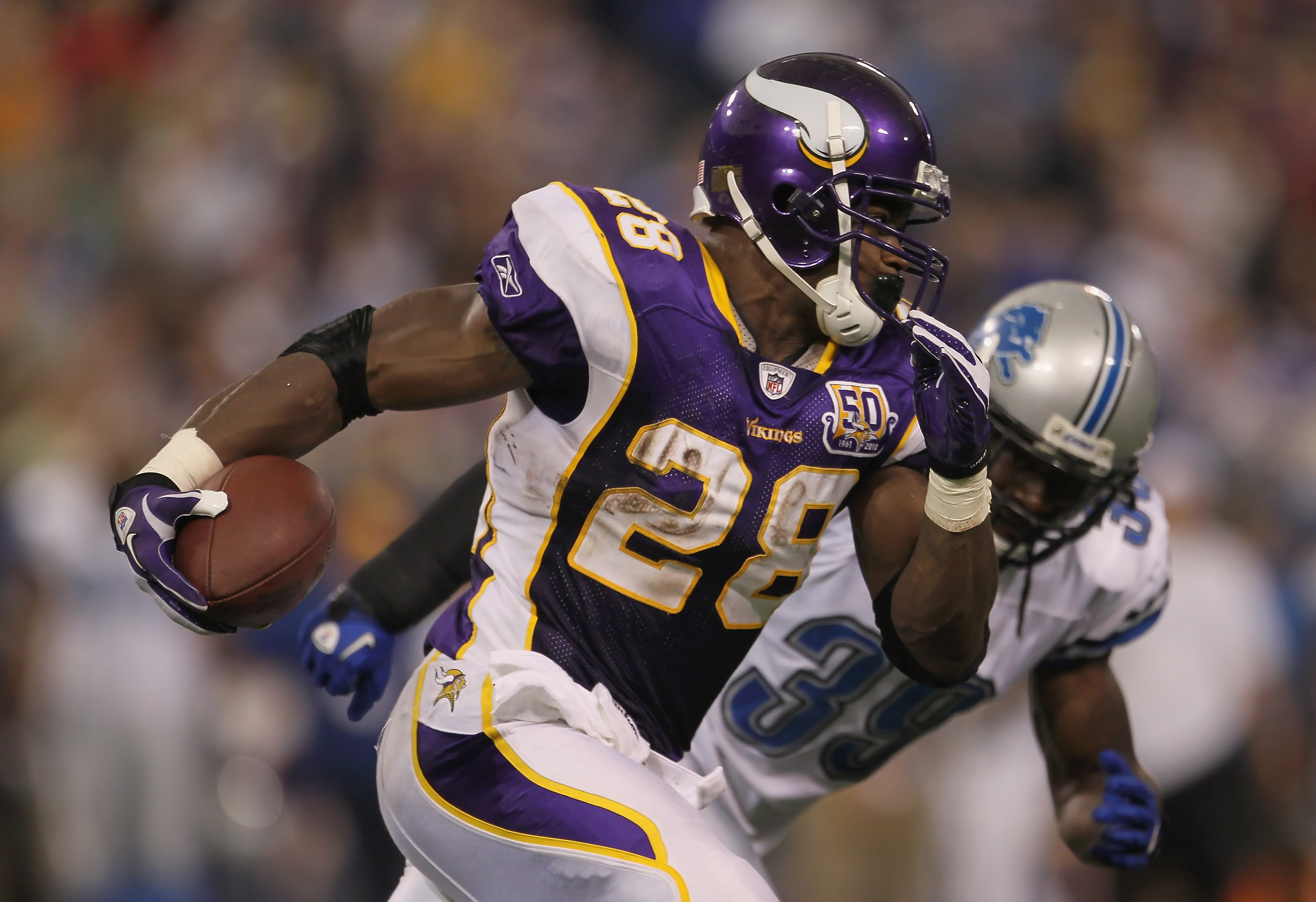 MINNEAPOLIS - SEPTEMBER 26:  Running back Adrian Peterson #28 of the Minnesota Vikings carries the ball around C.C. Brown #39 of the Detroit Lions for a touchdown during the second half at Hubert H. Humphrey Metrodome on September 26, 2010 in Minneapolis,
