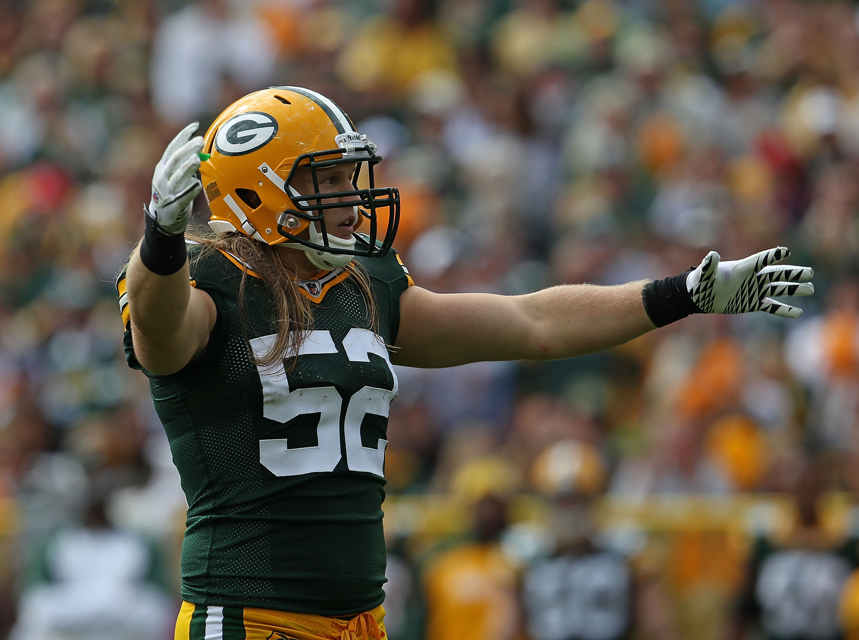 GREEN BAY, WI - SEPTEMBER 19: Clay Matthews #52 of the Green Bay Packers encourages the crowd during a game against the Buffalo Bills at Lambeau Field on September 19, 2010 in Green Bay, Wisconsin. The Packers defeated the Bills 34-7.  (Photo by Jonathan