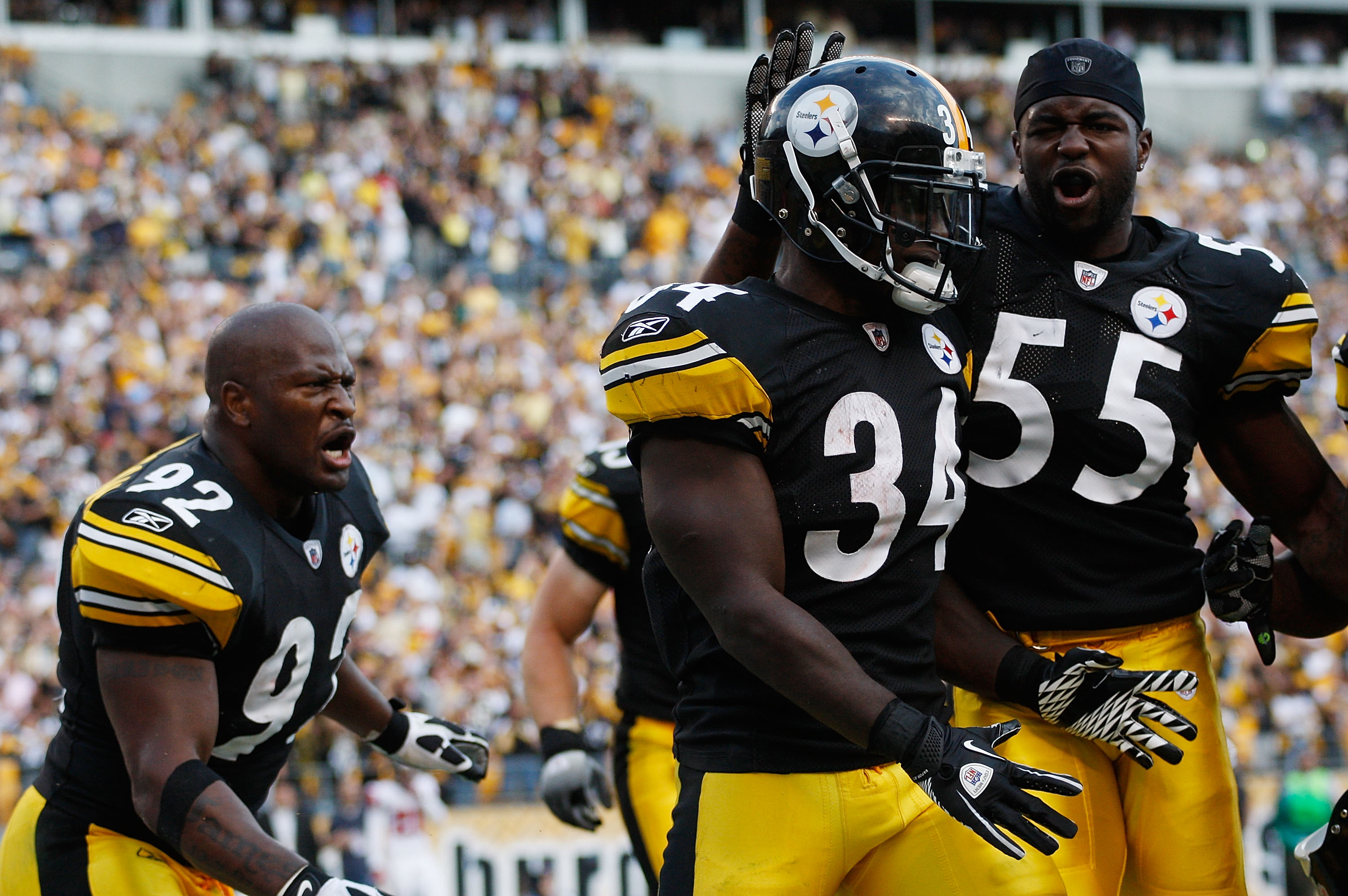 PITTSBURGH - SEPTEMBER 12:  Rashard Mendenhall #34 of the Pittsburgh Steelers celebrates with teammates Stevenson Sylvester #55 and James Harrison #92 after scoring the game winning touchdown on a 50-yard run against the Atlanta Falcons during the NFL sea