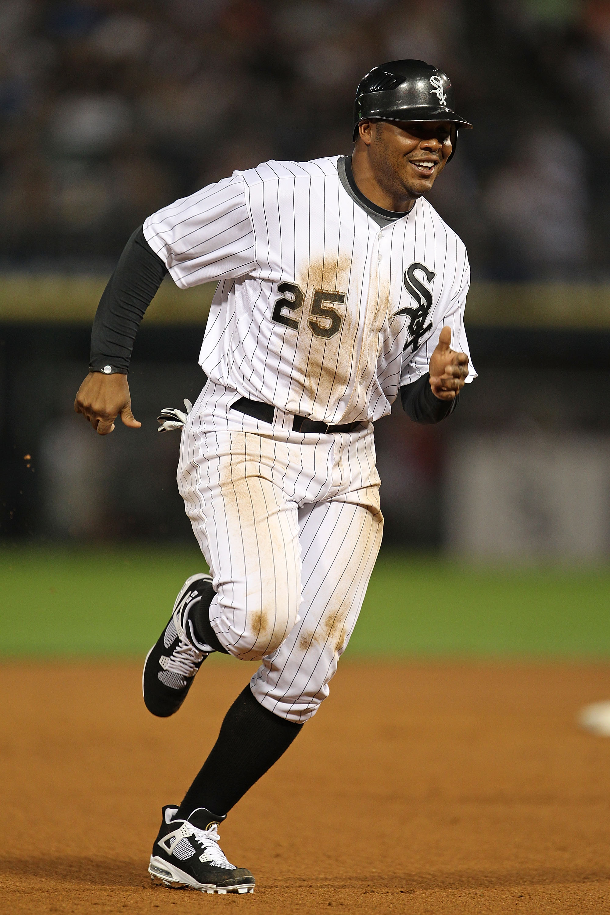 CHICAGO - JULY 26: Andruw Jones #25 of the Chicago White Sox smiles as he runs the bases against the Seattle Mariners at U.S. Cellular Field on July 26, 2010 in Chicago, Illinois. The White Sox defeated the Mariners 6-1. (Photo by Jonathan Daniel/Getty Im