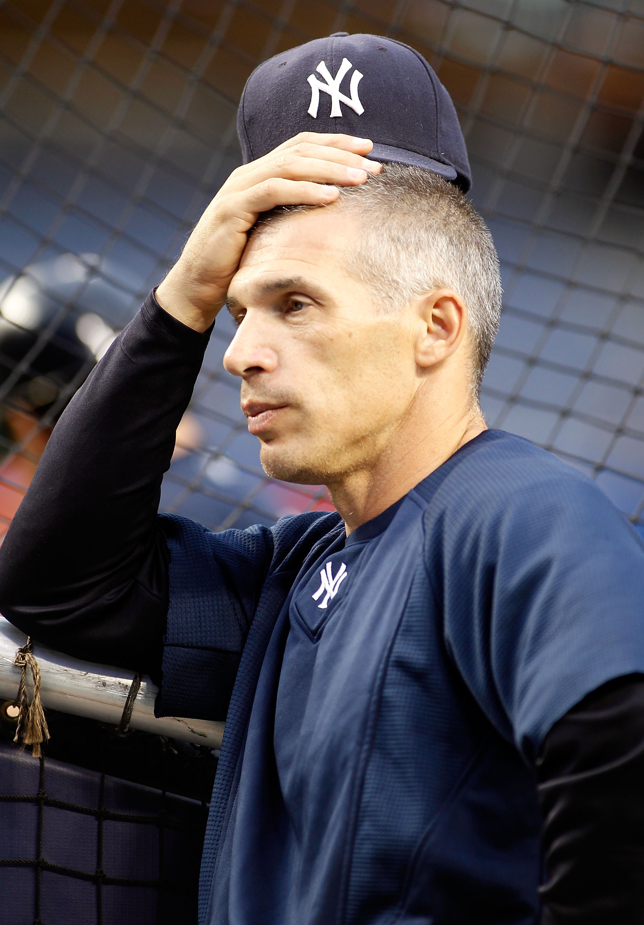 NEW YORK - SEPTEMBER 26: Manager Joe Girardi #28 of the New York Yankees looks on during warm-ups prior to their game against the Boston Red Sox on September 26, 2010 at Yankee Stadium in the Bronx borough of New York City.  (Photo by Mike Stobe/Getty Ima