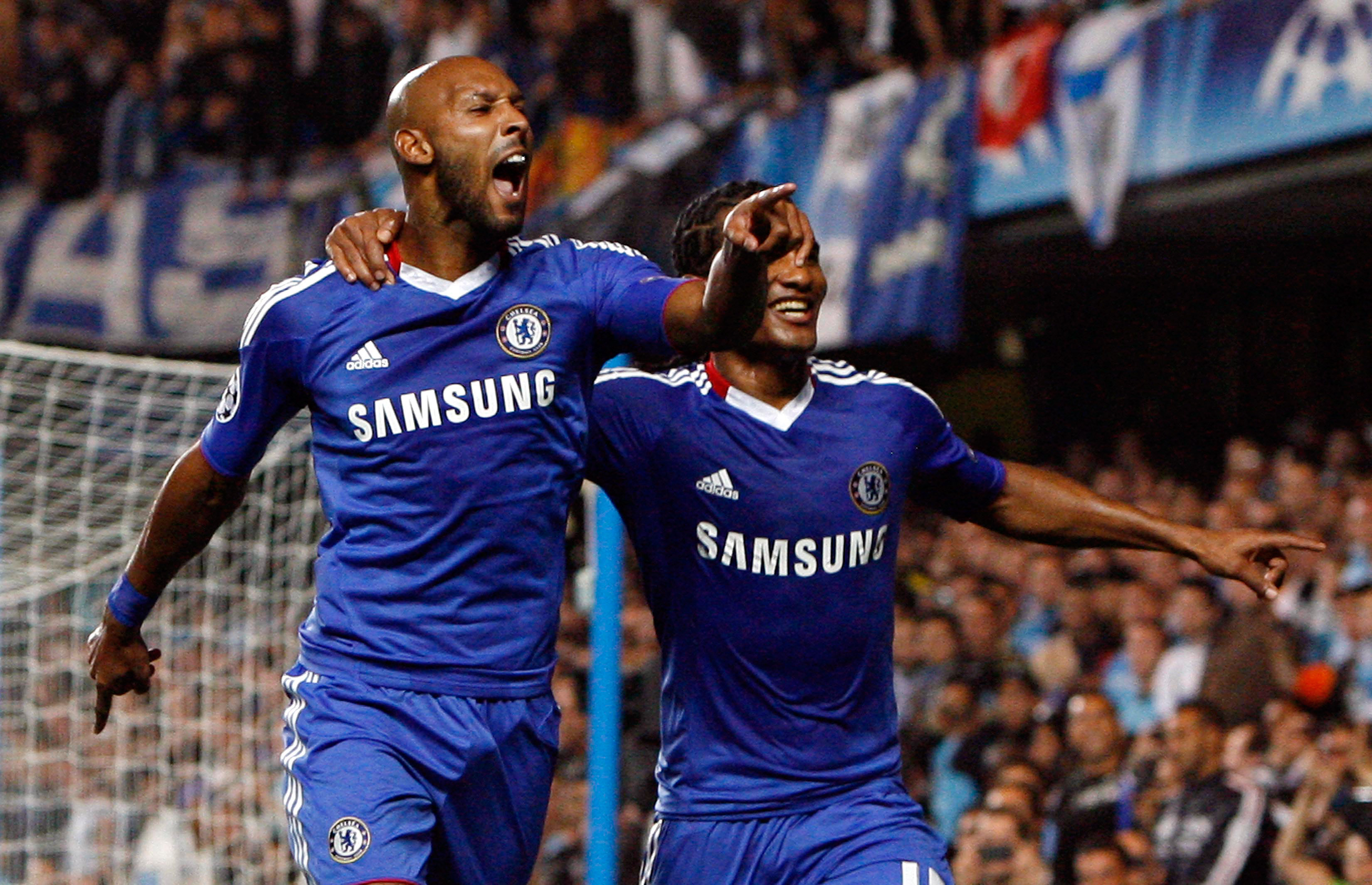LONDON, ENGLAND - SEPTEMBER 28 :   Nicolas Anelka (L) of Chelsea celebrates his goal from the penalty spot with team-mate Florent Malouda during the UEFA Champions League Group F match between Chelsea and Marseille at Stamford Bridge on September 28, 2010