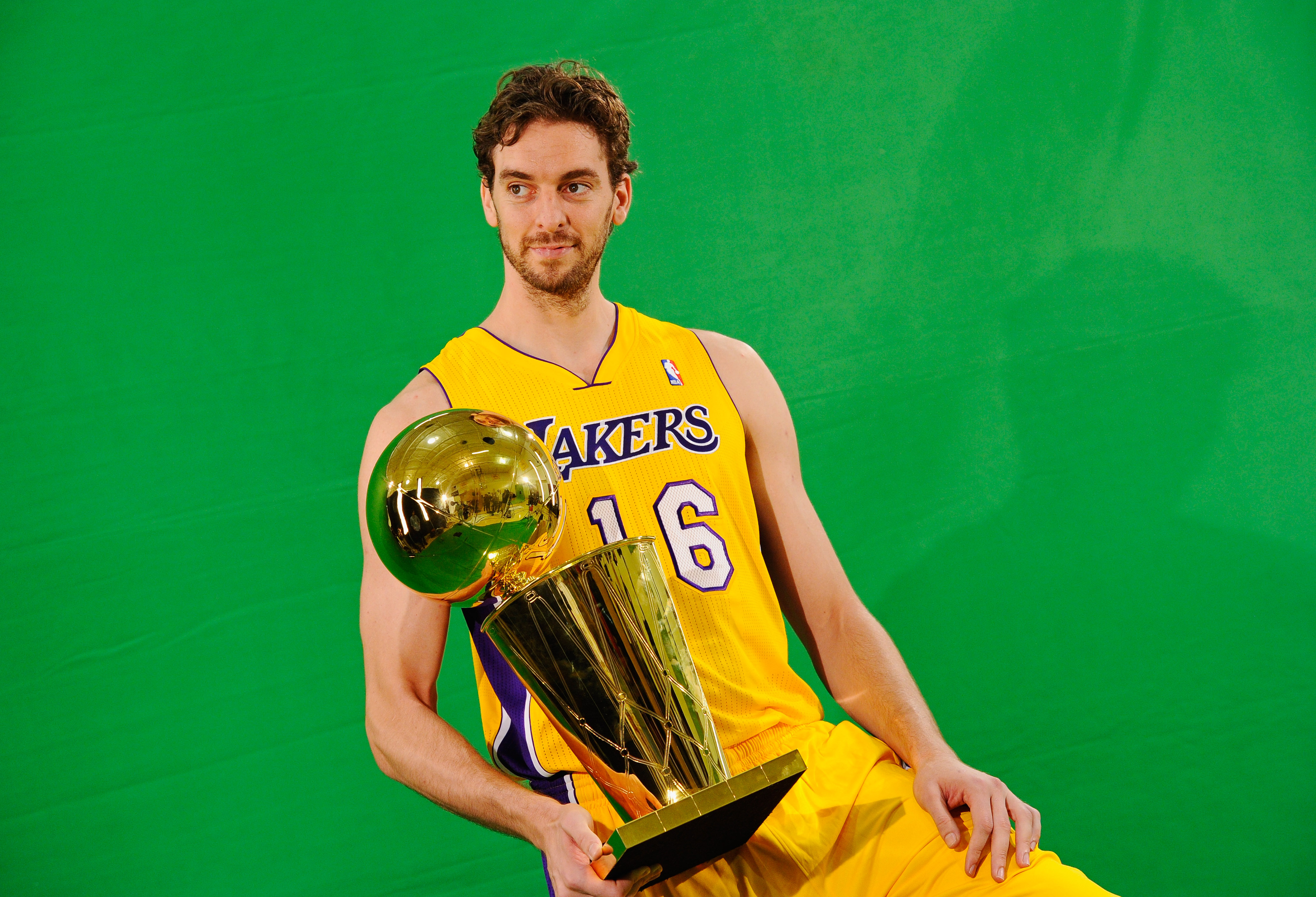 EL SEGUNDO, CA - SEPTEMBER 25:  Pau Gasol #16 of the Los Angeles Lakers poses for a photograph with the NBA Finals Larry O'Brien Championship Trophy during Media Day at the Toyota Center on September 25, 2010 in El Segundo, California. NOTE TO USER: User