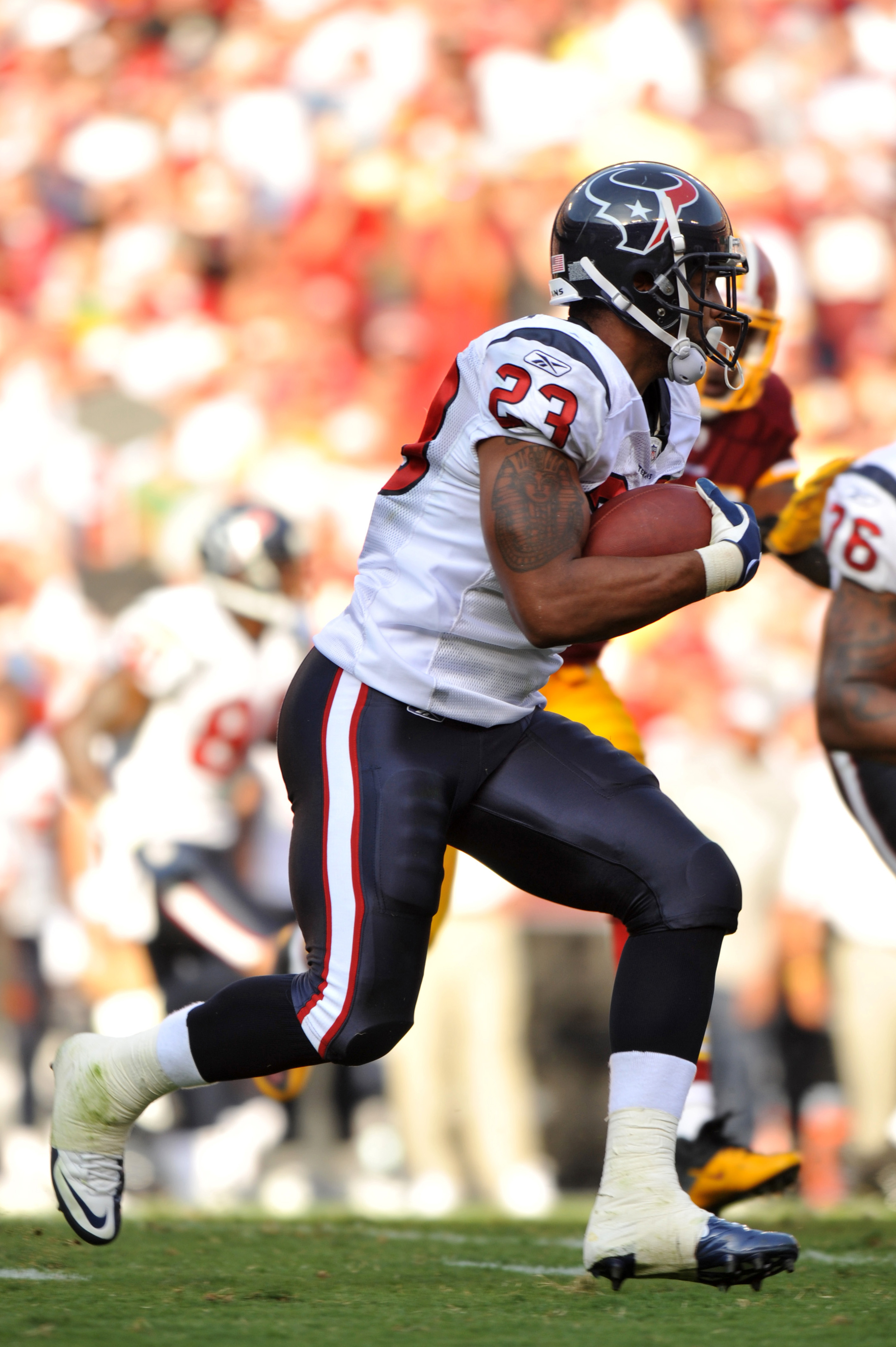 LANDOVER - SEPTEMBER 19:  Arian Foster #23 of the Houston Texans runs the ball against the Washington Redskins at FedExField on September 19, 2010 in Landover, Maryland. The Texans defeated the Redskins 30-27 in overtime. (Photo by Larry French/Getty Imag