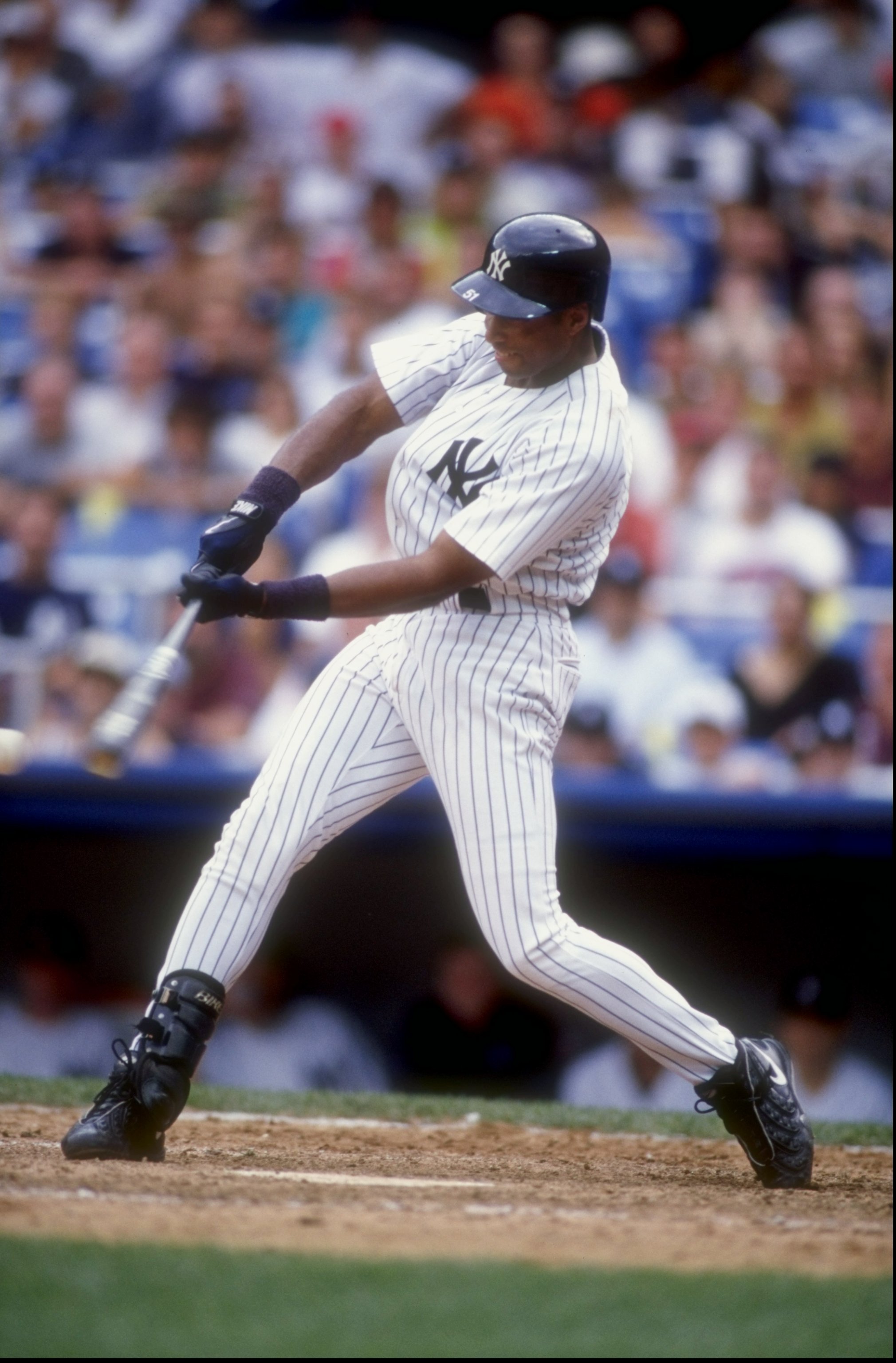 26 Aug 1998:  Bernie Williams #51 of the New York Yankees swings at a pitch during a game against the Anaheim Angels at Yankee Stadium in the Bronx, New York. The Angels defeated the Yankees 6-4.