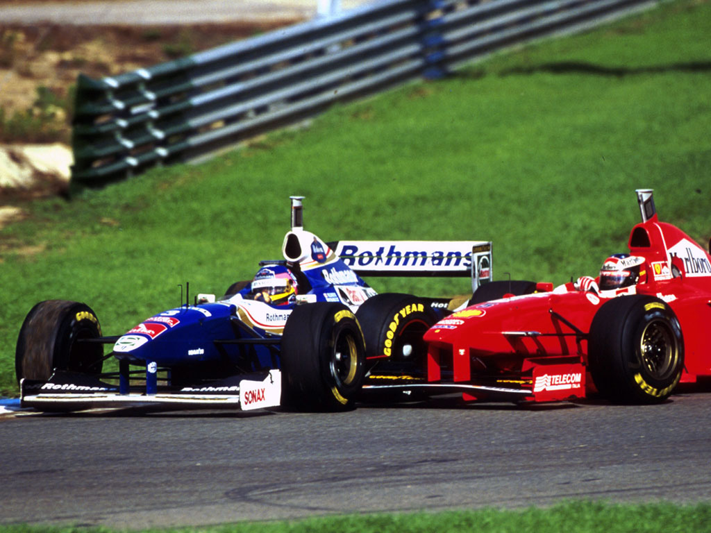 Schumacher tries unsuccessfully to knock Villeneuve out of the championship decider at Jerez.