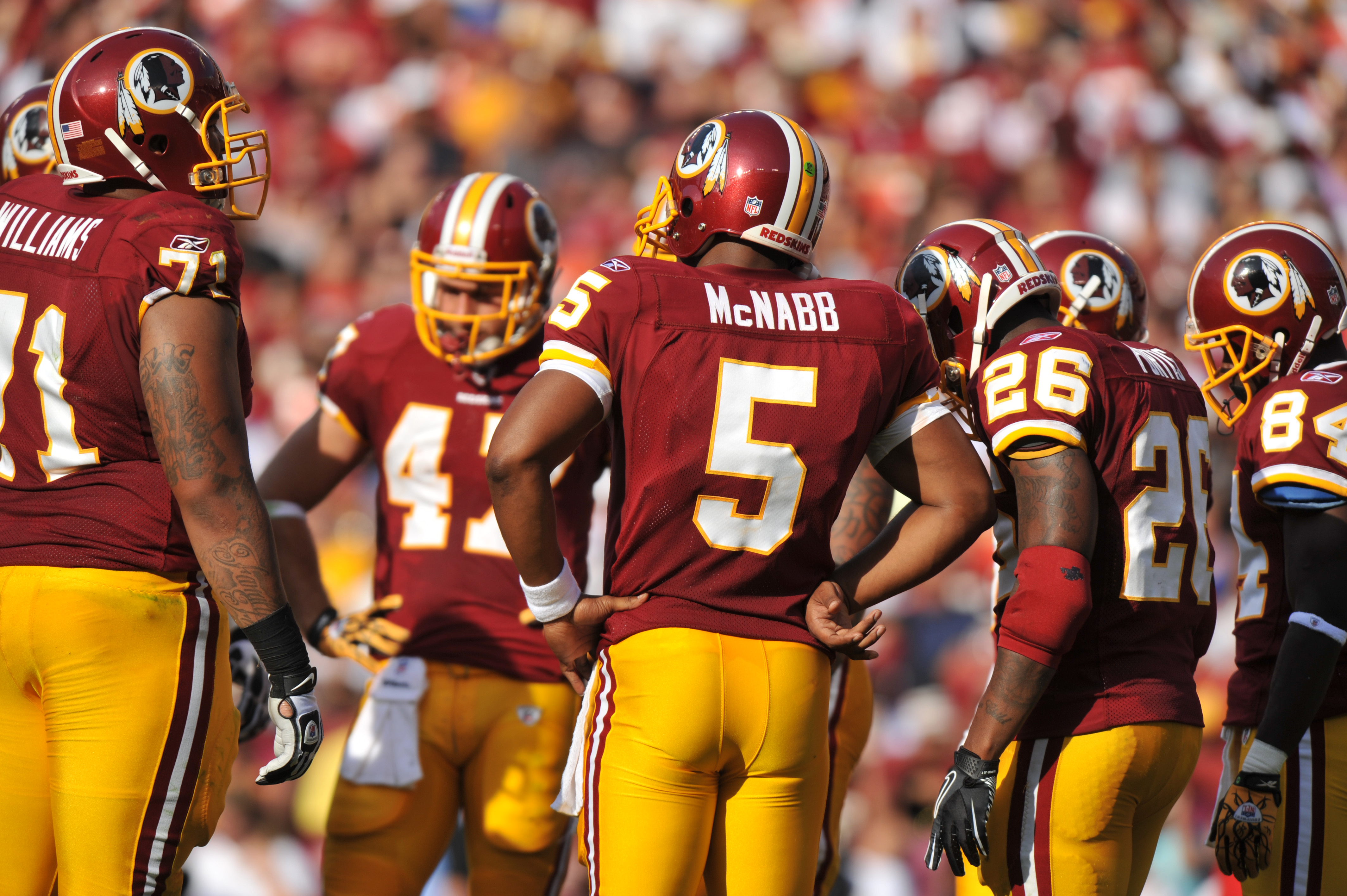 LANDOVER - SEPTEMBER 19:  Donovan McNabb #5 of the Washington Redskins leads the huddle during the game against the Houston Texans at FedExField on September 19, 2010 in Landover, Maryland. The Texans defeated the Redskins in overtime 30-27. (Photo by Lar