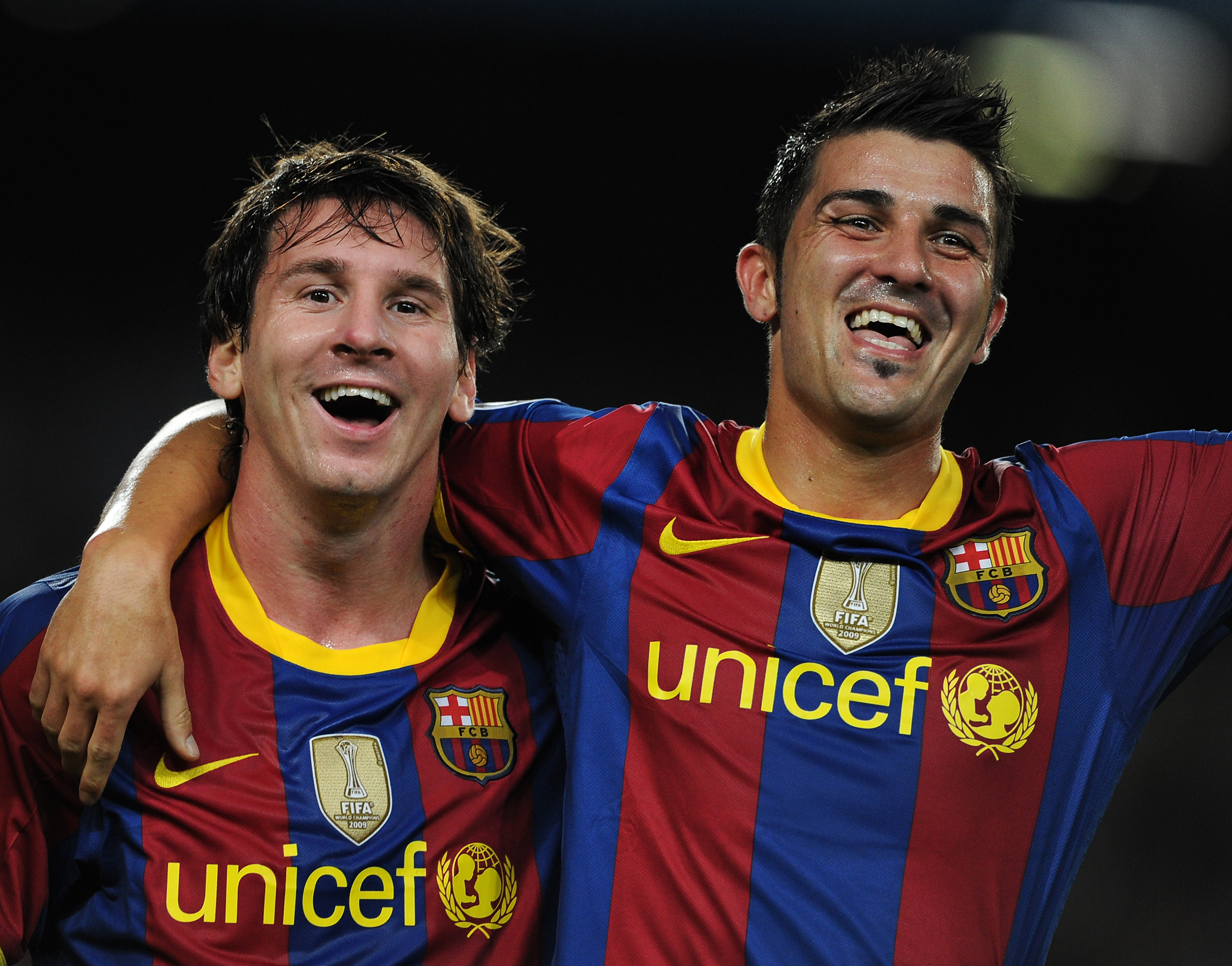BARCELONA, SPAIN - SEPTEMBER 14:  David Villa (R) of Barcelona celebrates scoring his sides second goal with his teammate Lionel Messi during the UEFA Champions League group D match between Barcelona and Panathinaikos on September 14, 2010 in Barcelona, S