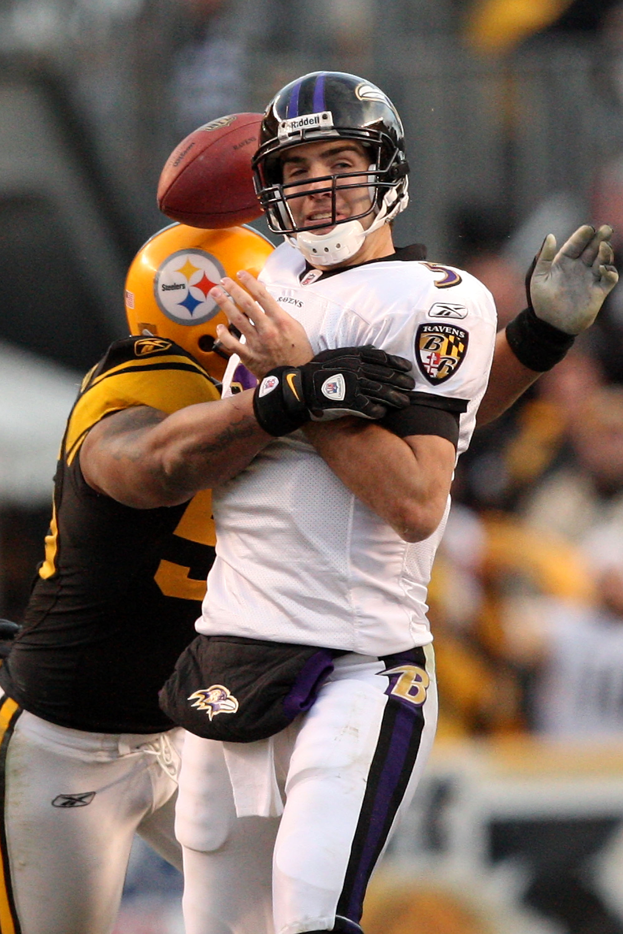 PITTSBURGH - DECEMBER 27:  LaMarr Woodley #56 of the Pittsburgh Steelers forces Joe Flacco #5 of the Baltimore Ravens to fumble during the game at Heinz Field on December 27, 2009 in Pittsburgh, Pennsylvania.  Pittsburgh won the game, 23-20. (Photo by Kar