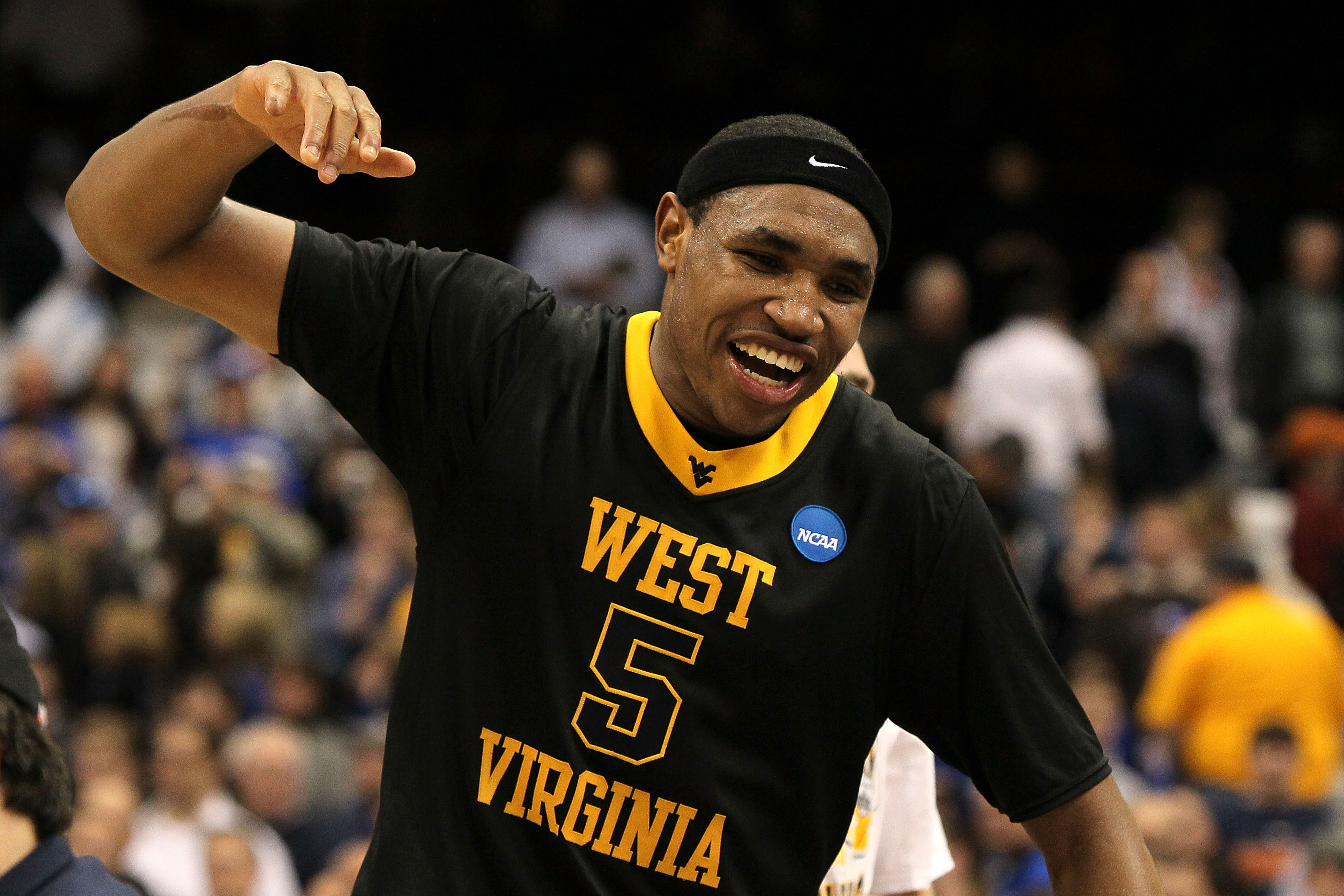 SYRACUSE, NY - MARCH 27: Kevin Jones #5 of the West Virginia Mountaineers celebrates after West Virginia won 73-66 against the Kentucky Wildcats during the east regional final of the 2010 NCAA men's basketball tournament at the Carrier Dome on March 27,