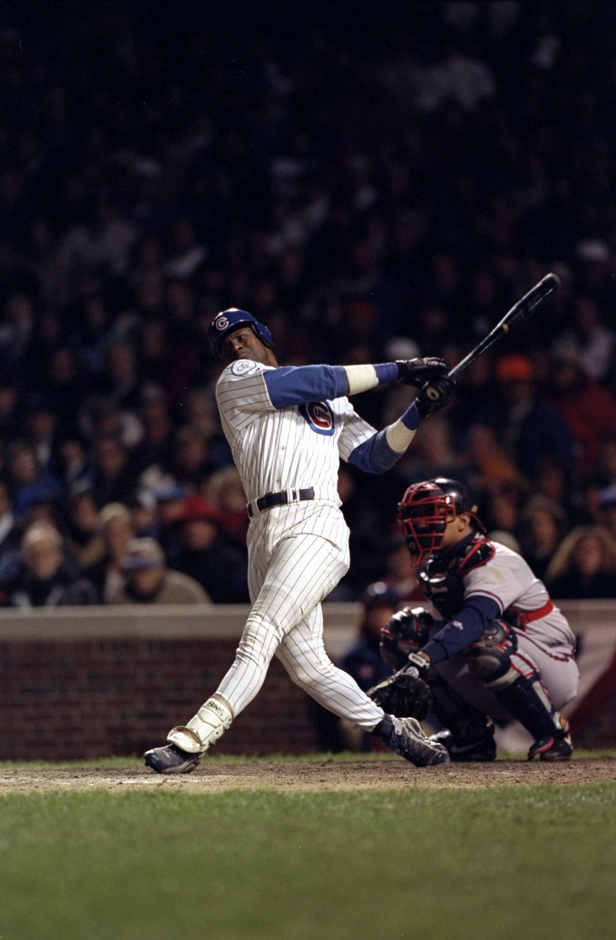 3 Oct 1998:  Right fielder Sammy Sosa #21 of the Chicago Cubs swings at a pitch during game three of the National League Divisional Series against the Atlanta Braves at Wrigley Field in Chicago, Illinois. The Braves defeated the Cubs 6-2. Mandatory Credit