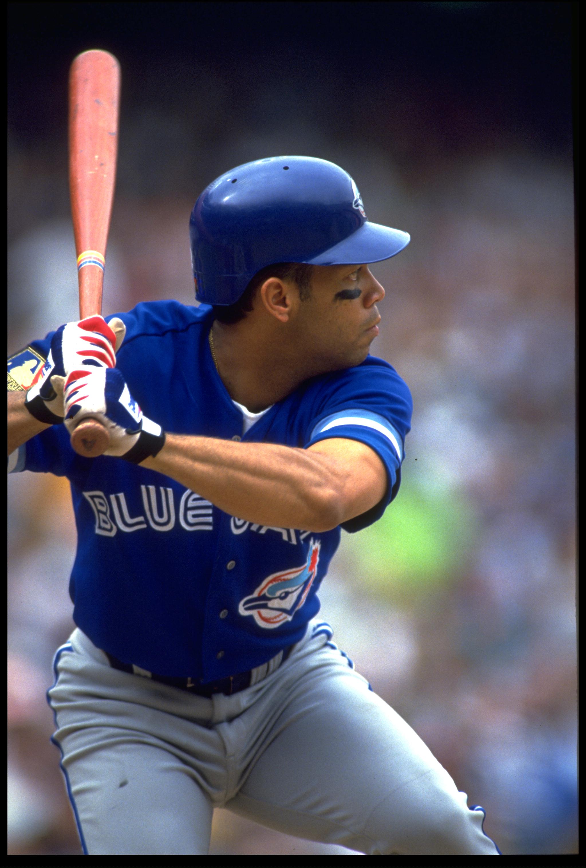 17 Apr 1994: ROBERTO ALOMAR, SECOND BASEMAN FOR THE TORONTO BLUE JAYS, BATS DURING THEIR GAME AGAINST THE CALIFORNIA ANGELS AT ANAHEIM STADIUM IN ANAHEIM, CALIFORNIA.