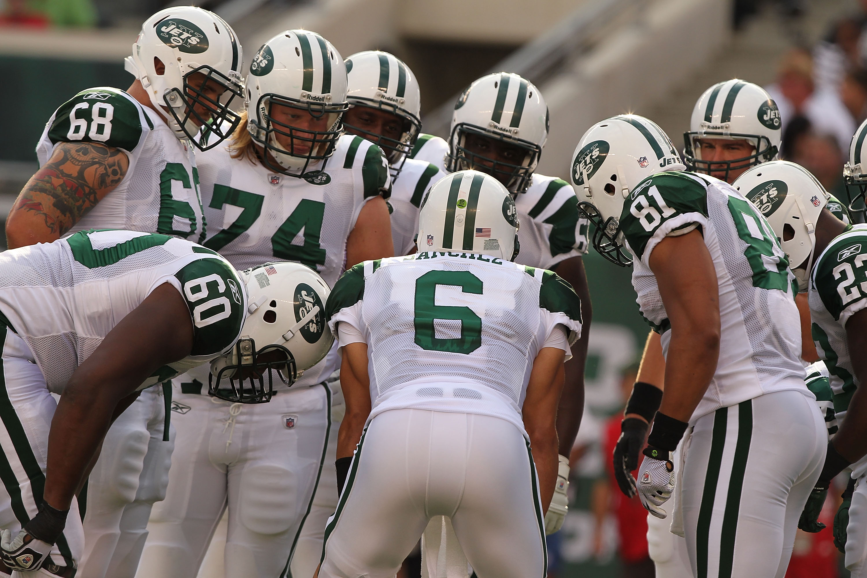 EAST RUTHERFORD, NJ - SEPTEMBER 19:  Mark Sanchez #6 of the New York Jets calls the huddle against  the New England Patriots during their  game on September 19, 2010 at the New Meadowlands Stadium  in East Rutherford, New Jersey.  (Photo by Al Bello/Getty