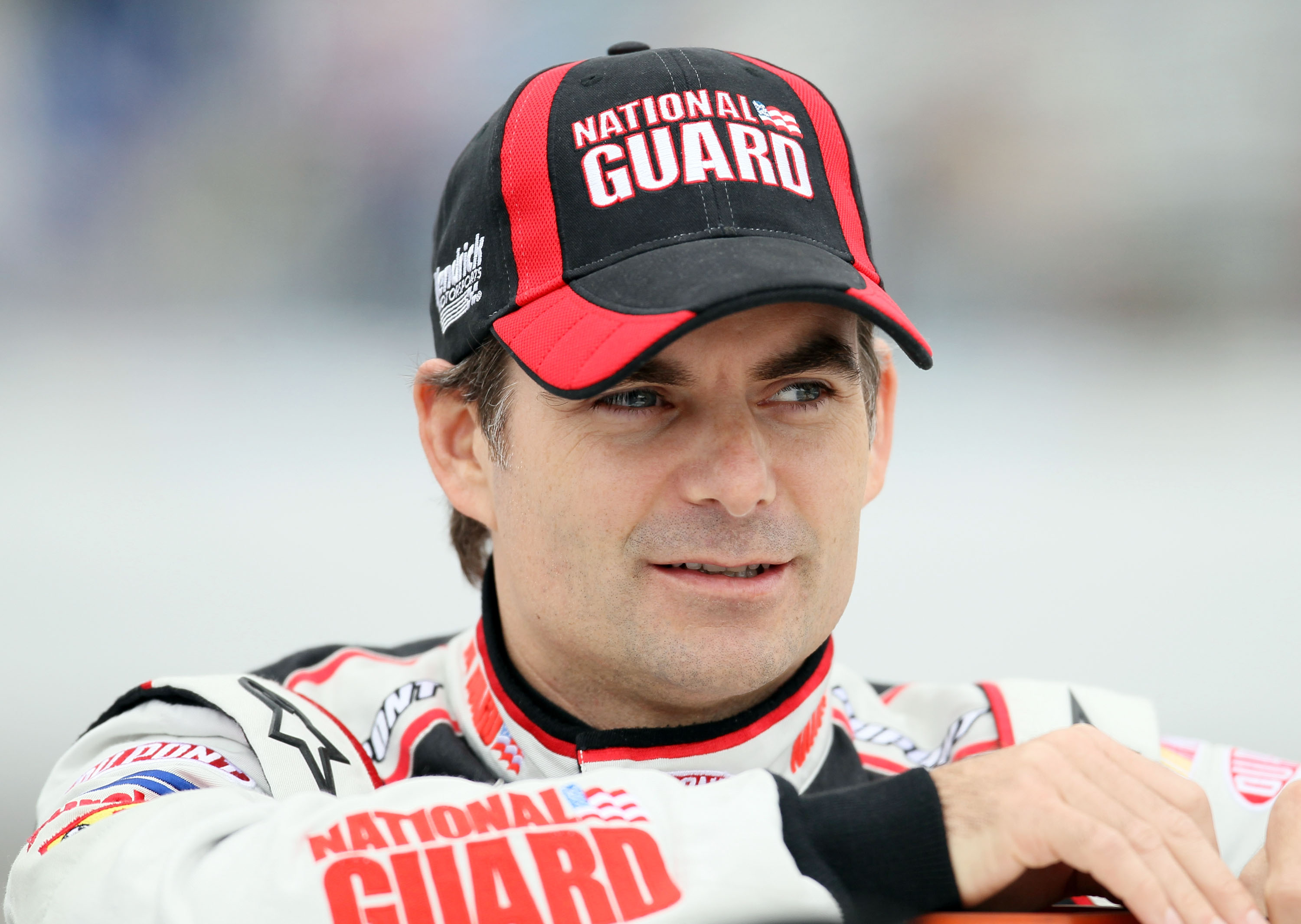 LOUDON, NH - SEPTEMBER 17:  Jeff Gordon, driver of the #24 DuPont National Guard Facebook Chevrolet, stands near his car during qualifying for the NASCAR Sprint Cup Series Sylvania 300 at New Hampshire Motor Speedway on September 17, 2010 in Loudon, New H