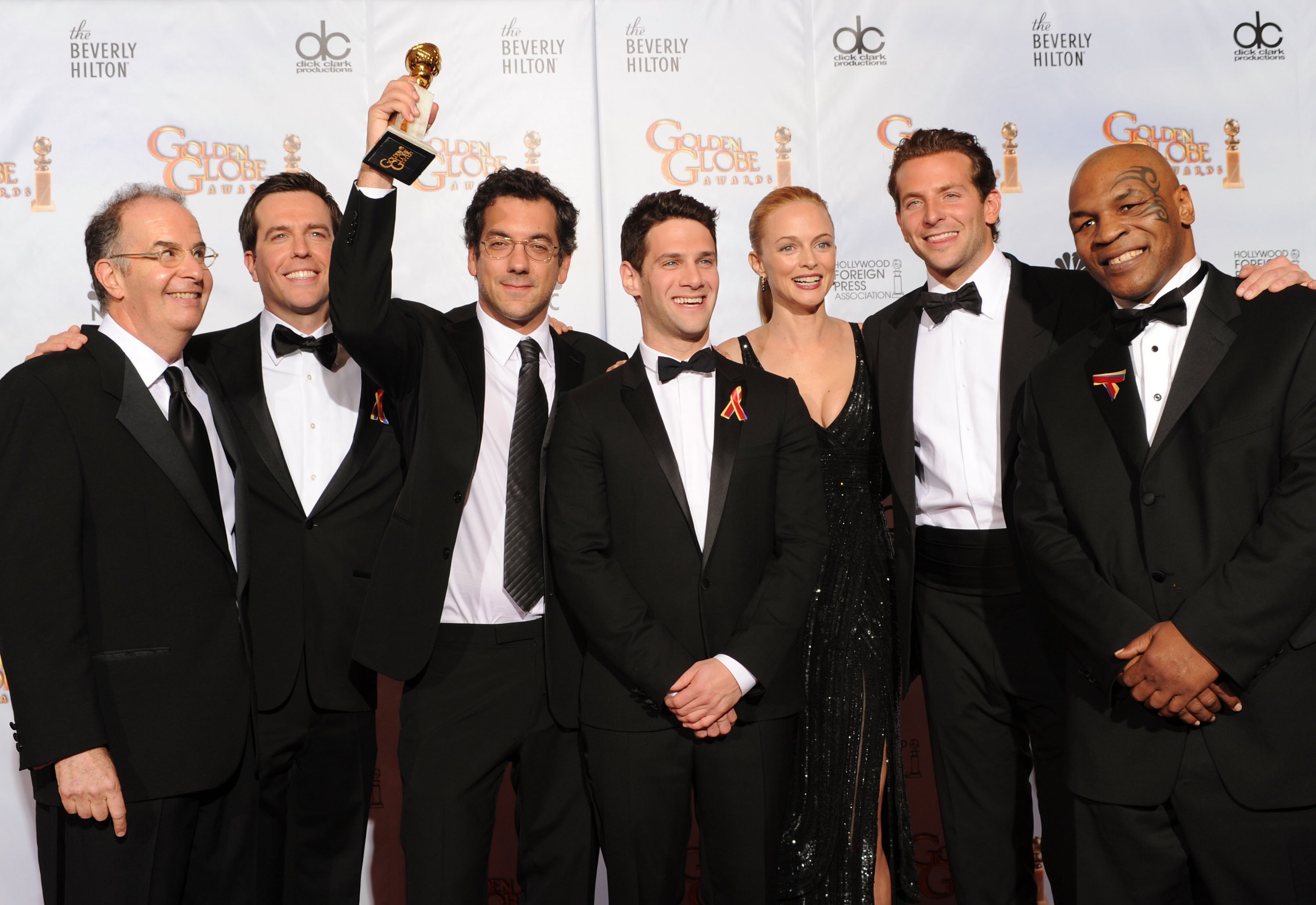 BEVERLY HILLS, CA - JANUARY 17:  (L-R) Actors Ed Helms, Justin Bartha, director Todd Phillips, actress Heather Graham, actor Bradley Cooper and former heavyweight boxer Mike Tyson pose in the press room with the Best Motion Picture Comedy or Musical award