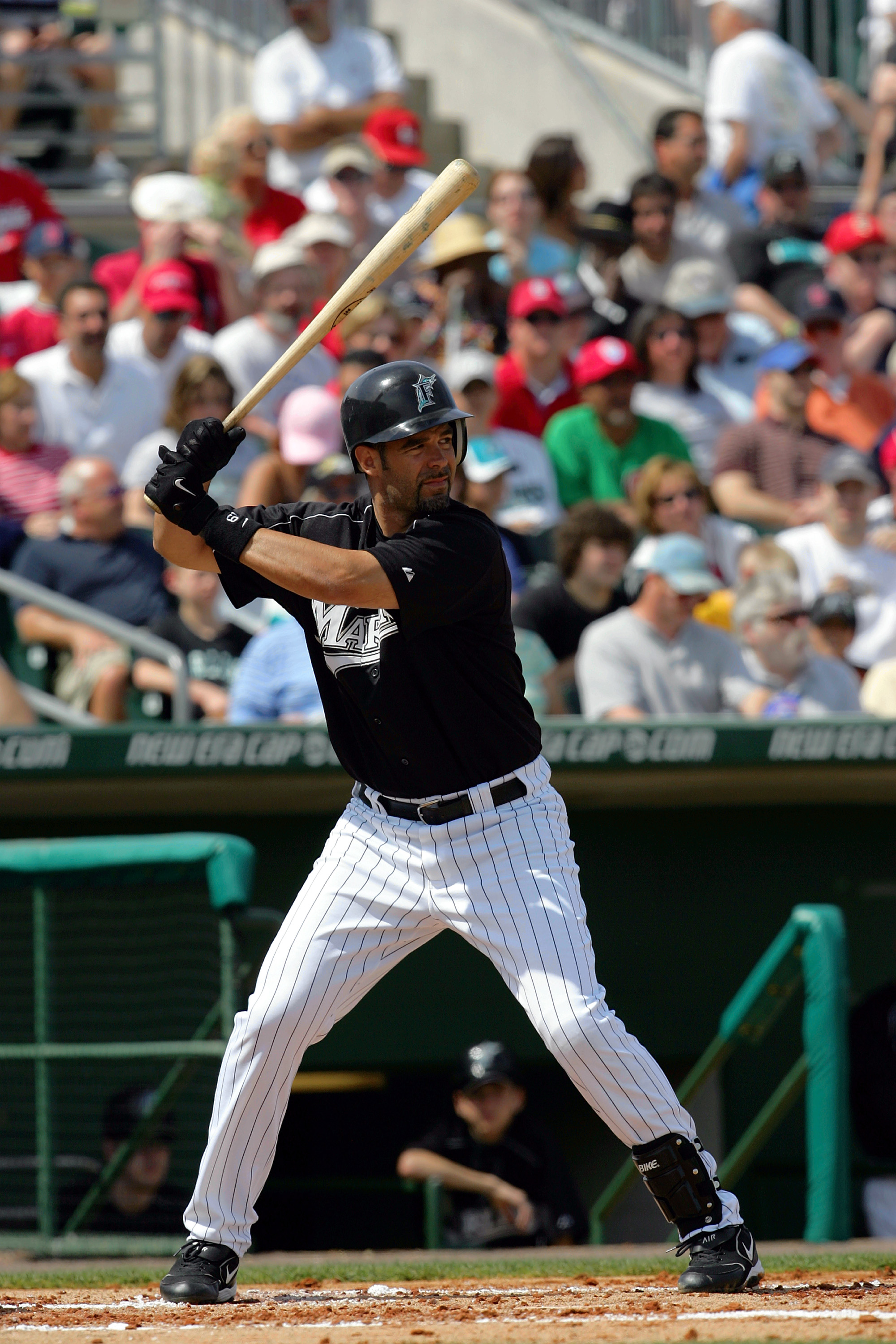 JUPITER, FL - MARCH 6:  Mike Lowell #19 of the Florida Marlins at bat against the St. Louis Cardinals during MLB Spring Training on March 6, 2005 at Robert Dean Stadium in Jupiter, Florida. The Cardinals defeated the Marlins 5-1.  (Photo by Ronald Martine