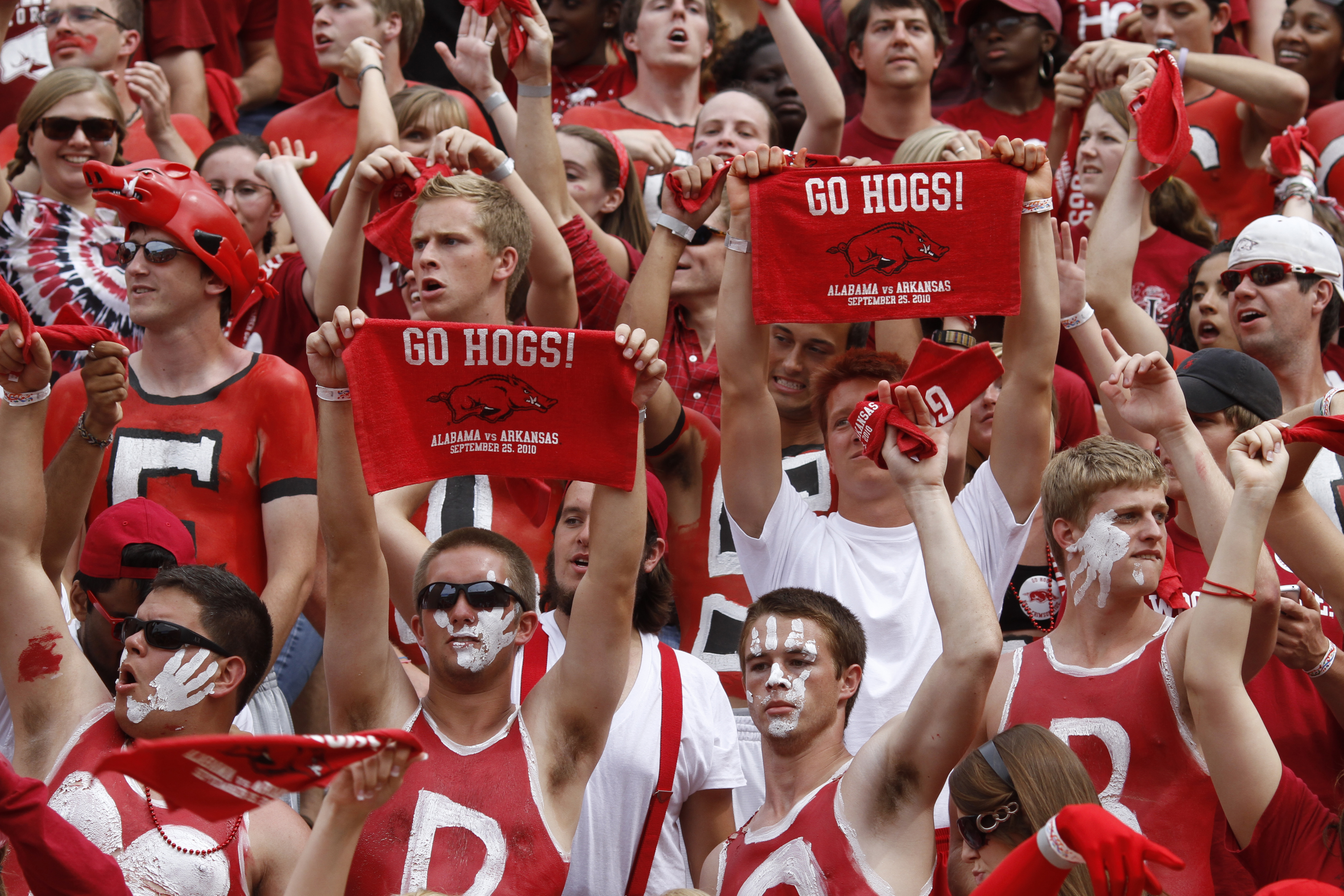 FAYETTEVILLE - SEPTEMBER 25: Arkansas Razorbacks fans cheer during the game against the Alabama Crimson Tide at Donald W. Reynolds Razorback Stadium on September 25, 2010 in Fayetteville, Arkansas. Alabama won 24-20. (Photo by Joe Robbins/Getty Images)