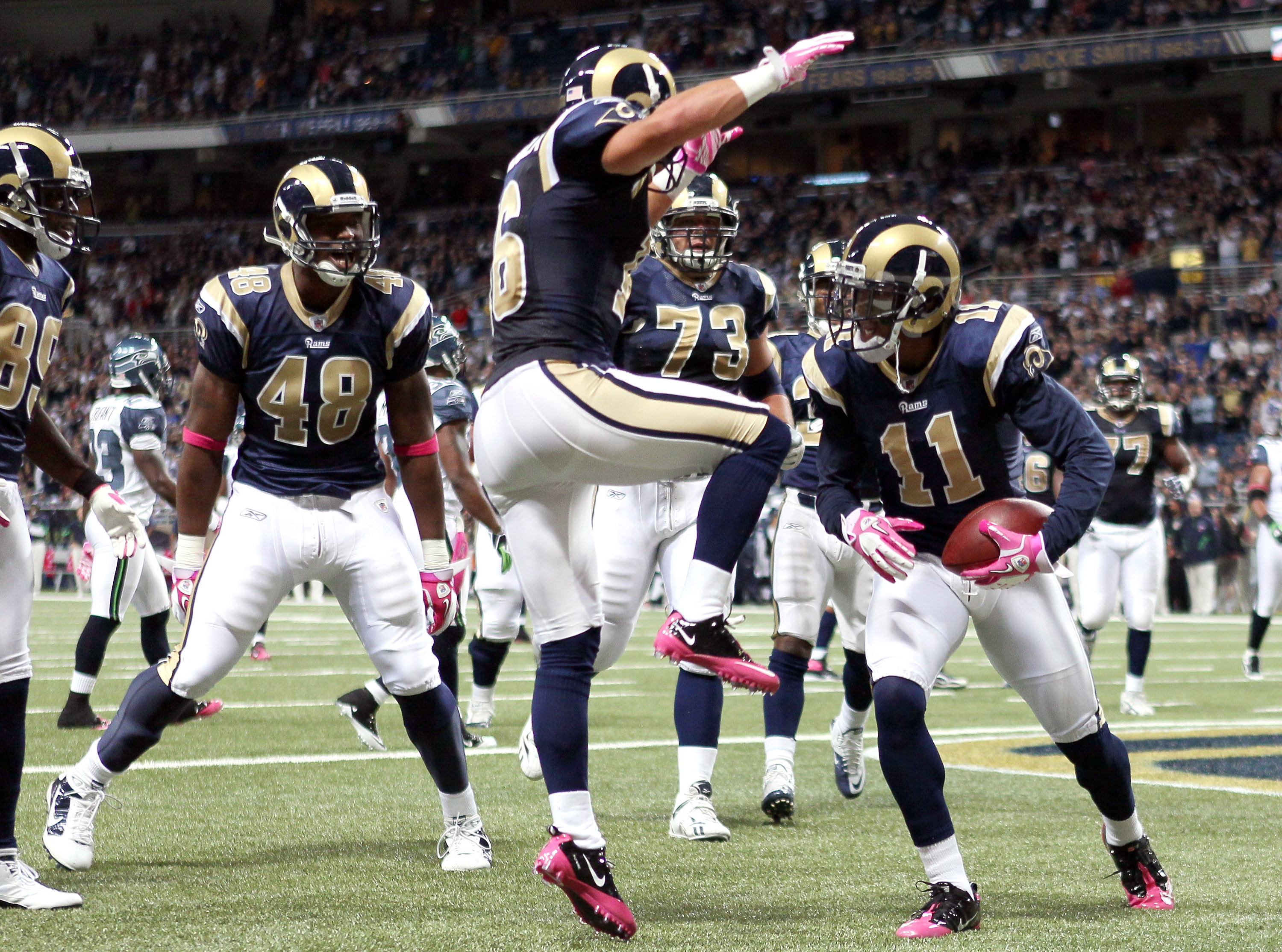 St. Louis Rams quarterback Sam Bradford (8) watches a replay after throwing  an interception for a touchdown against the Detroit Lions in the fourth  quarter of an NFL football game in Detroit