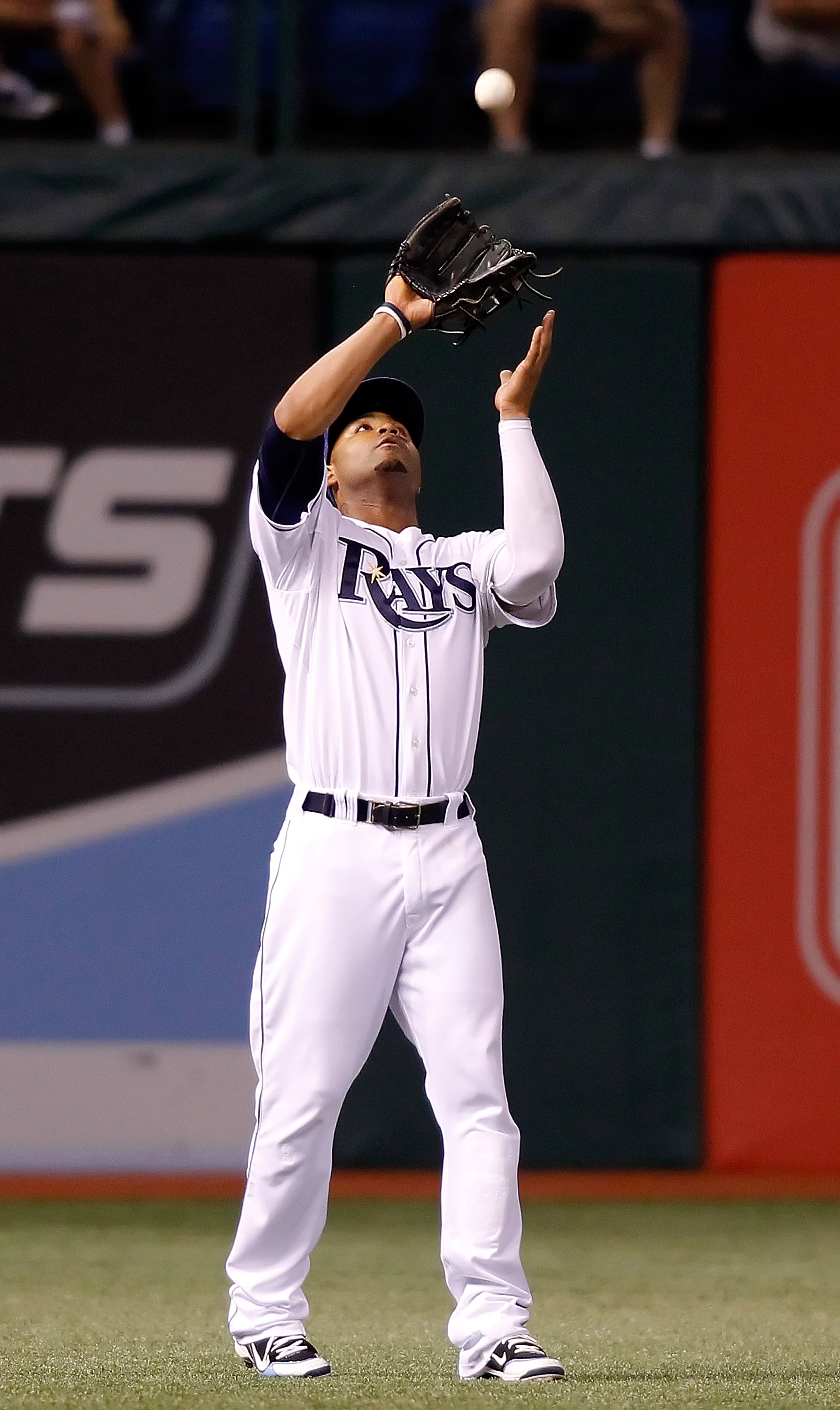 ST PETERSBURG, FL - SEPTEMBER 27:  Outfielder Carl Crawford #13 of the Tampa Bay Rays catches a fly ball against the Baltimore Orioles during the game at Tropicana Field on September 27, 2010 in St. Petersburg, Florida.  (Photo by J. Meric/Getty Images)