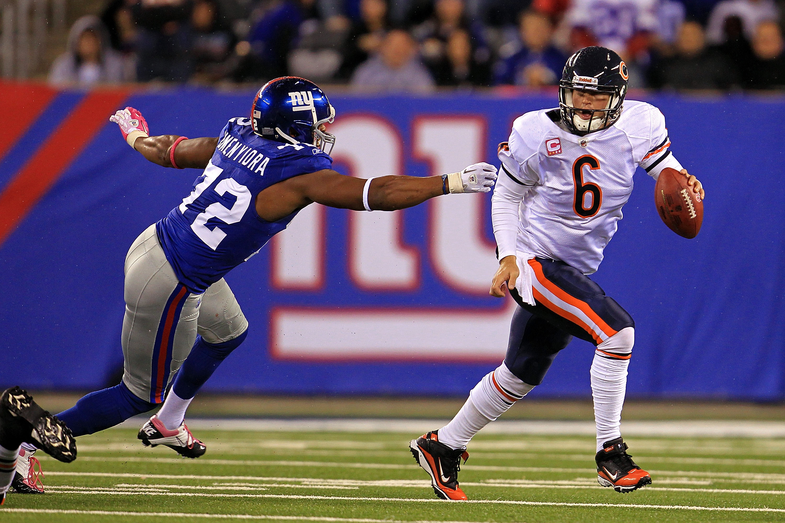 New York Jets Mark Sanchez gets sacked for 9 yards by New York Giants  Mathias Kiwanuka in the first quarter of a preseason game at Giants Stadium  in East Rutherford, New Jersey