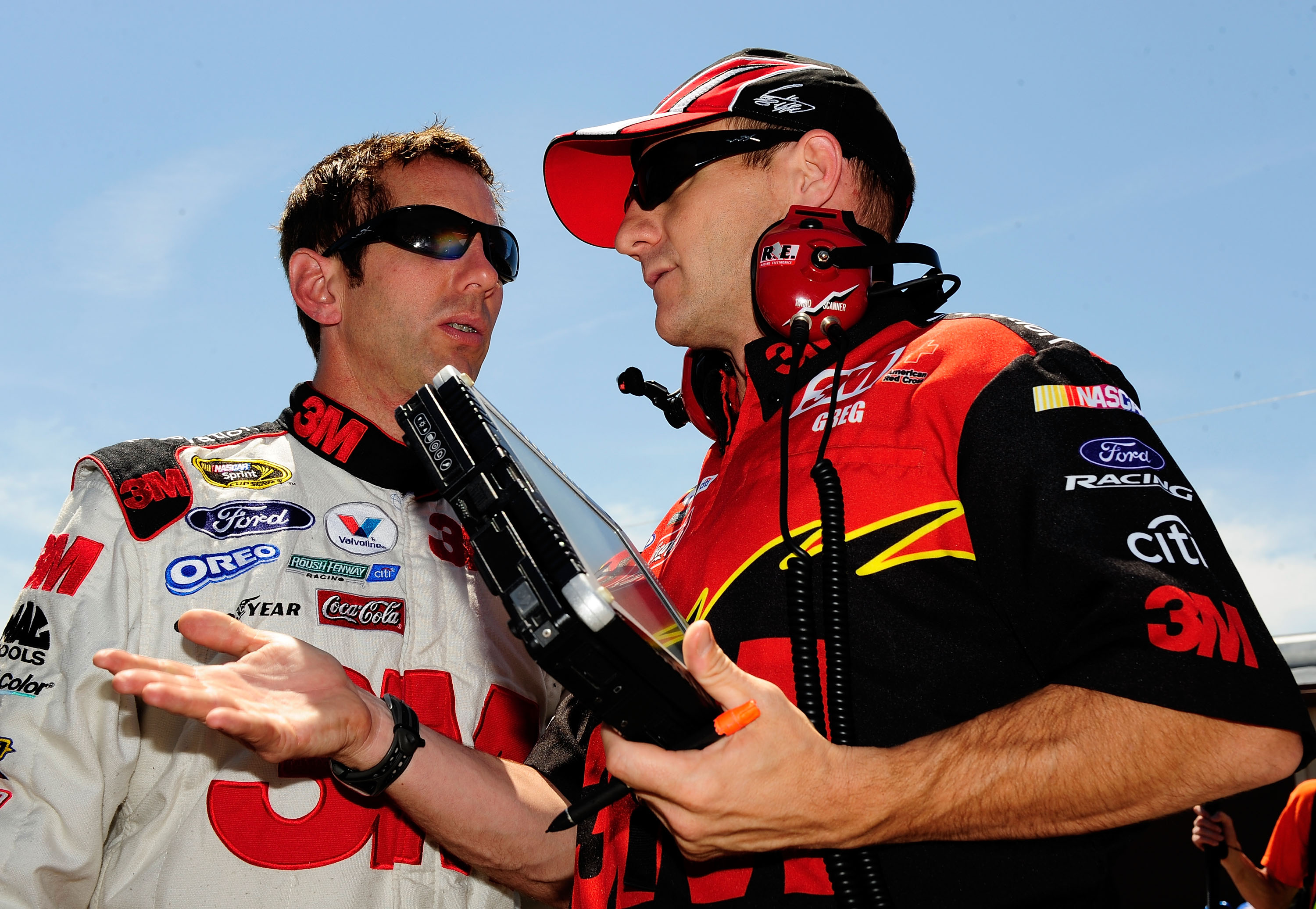 BROOKLYN, MI - JUNE 12:  Greg Biffle (L), driver of the #16 3M Ford, talks with crew chief Greg Erwin (R) during practice for the NASCAR Sprint Cup Series LifeLock 400 at Michigan International Speedway on June 12, 2009 in Brooklyn, Michigan.  (Photo by R