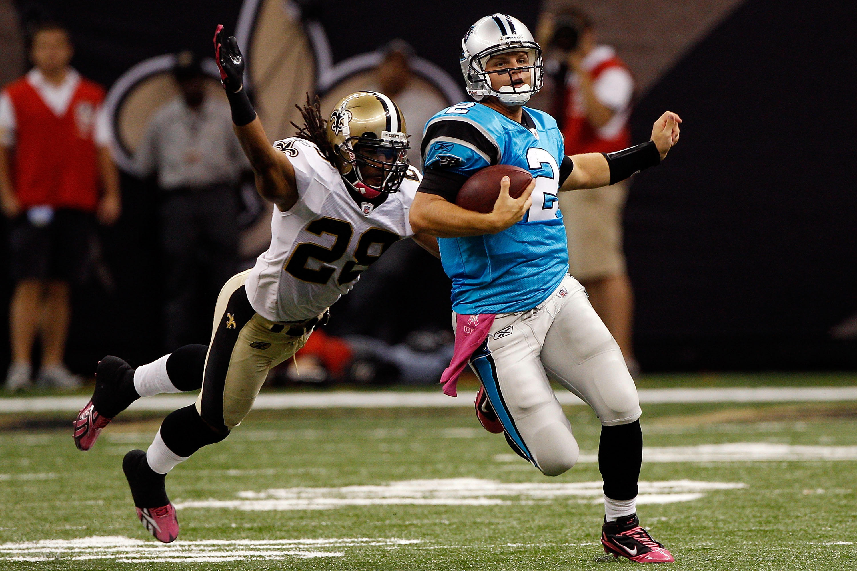 NEW ORLEANS - OCTOBER 03: Jimmy Clausen #2 of the Carolina Panthers is tackled by Usama Young #28 of the New Orleans Saints at the Louisiana Superdome on October 3, 2010 in New Orleans, Louisiana. (Photo by Chris Graythen/Getty Images)