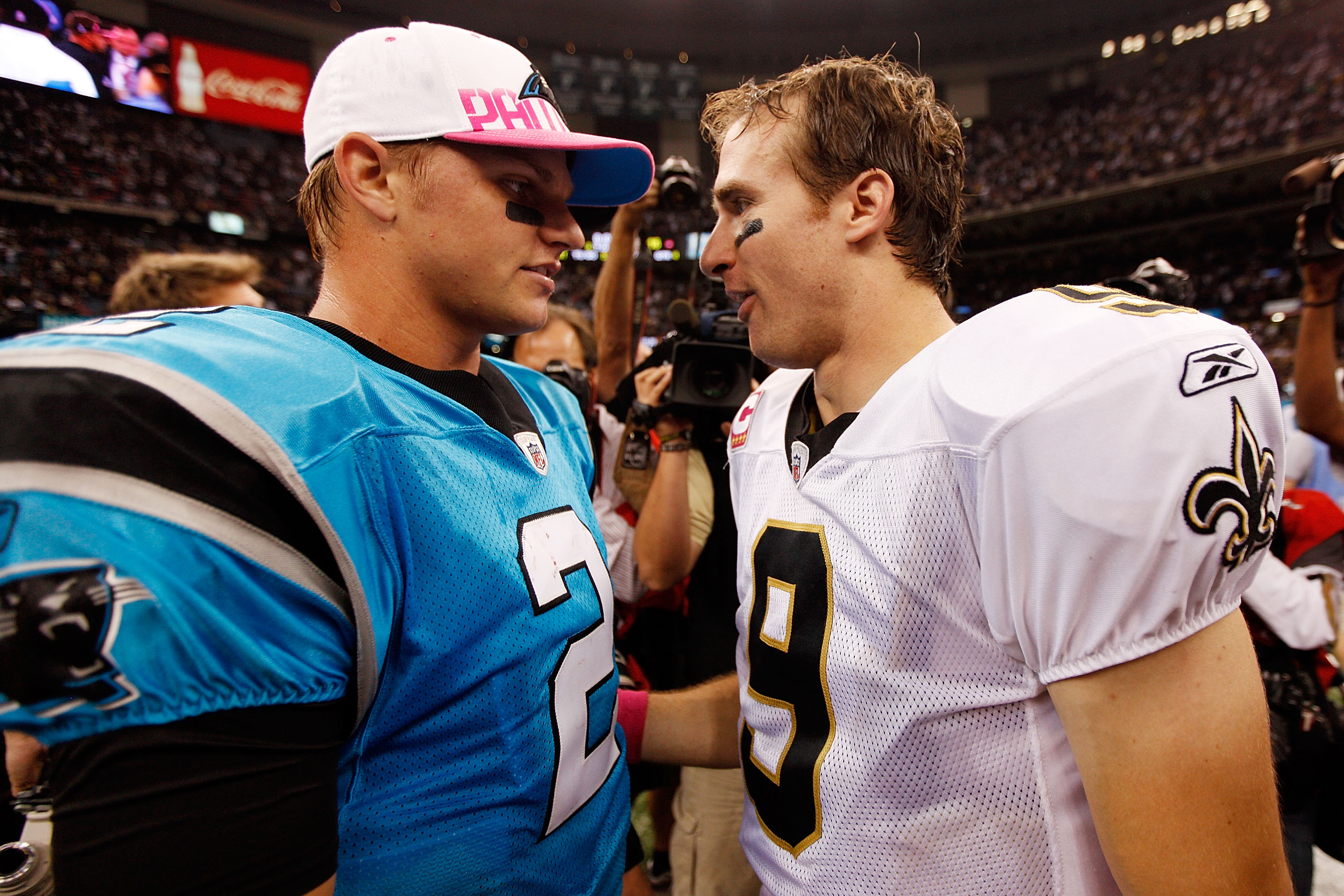 NEW ORLEANS - OCTOBER 03:  Drew Brees #9 of the New Orleans Saints talks with Jimmy Clausen #2 of the Carolina Panthers at the Louisiana Superdome on October 3, 2010 in New Orleans, Louisiana.  The Saints defeated the Panthers 16-14.  (Photo by Chris Gray