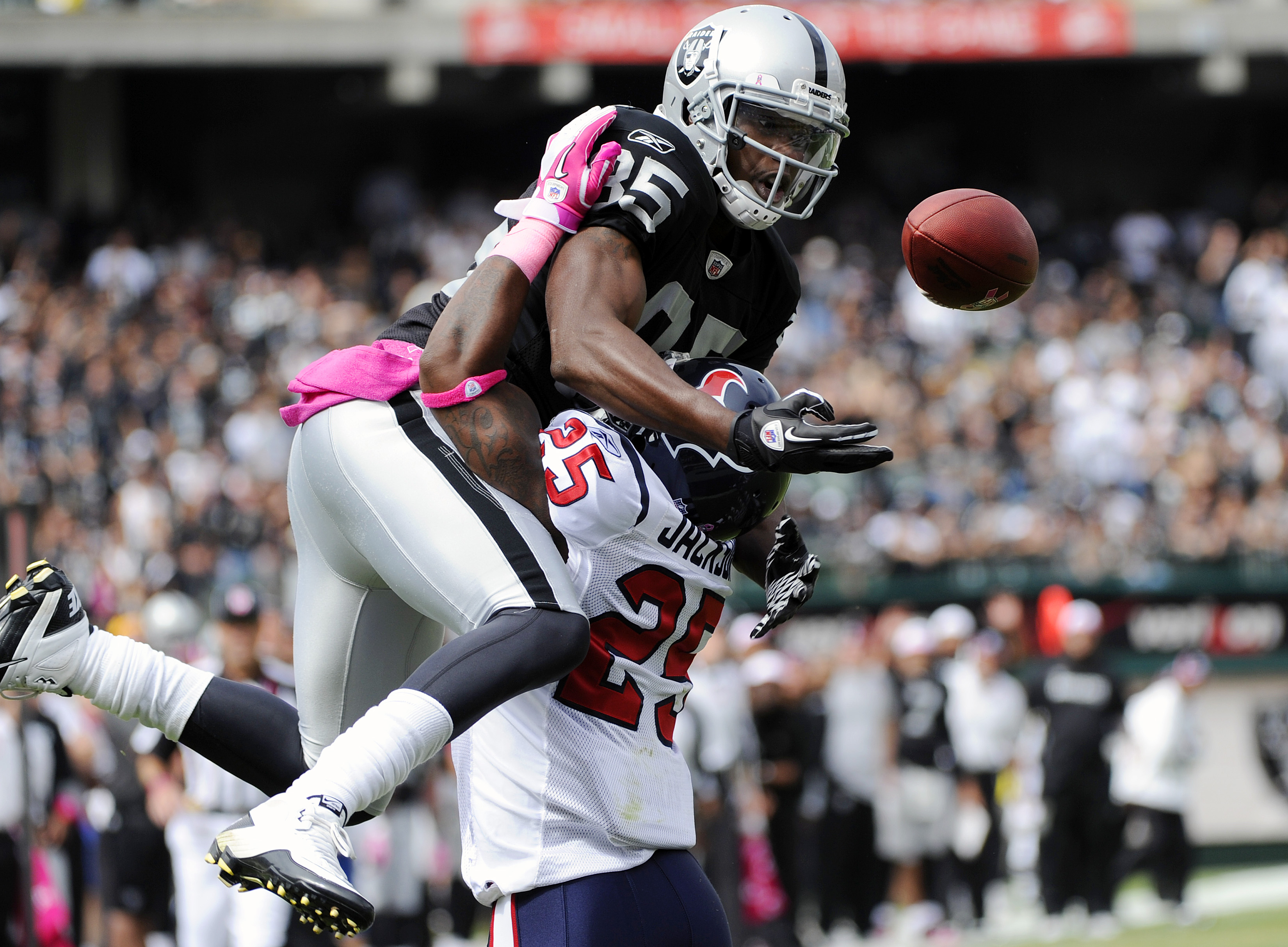 OAKLAND, CA - OCTOBER 3: Defensive Back Kareem Jackson #25 of the Houston Texans breaks up a pass in the endzone to wide receiver Darrius Heyward-Bey #85 of the Oakland Raiders during an NFL football game October 3, 2010 at The Oakland-Alameda County Coli