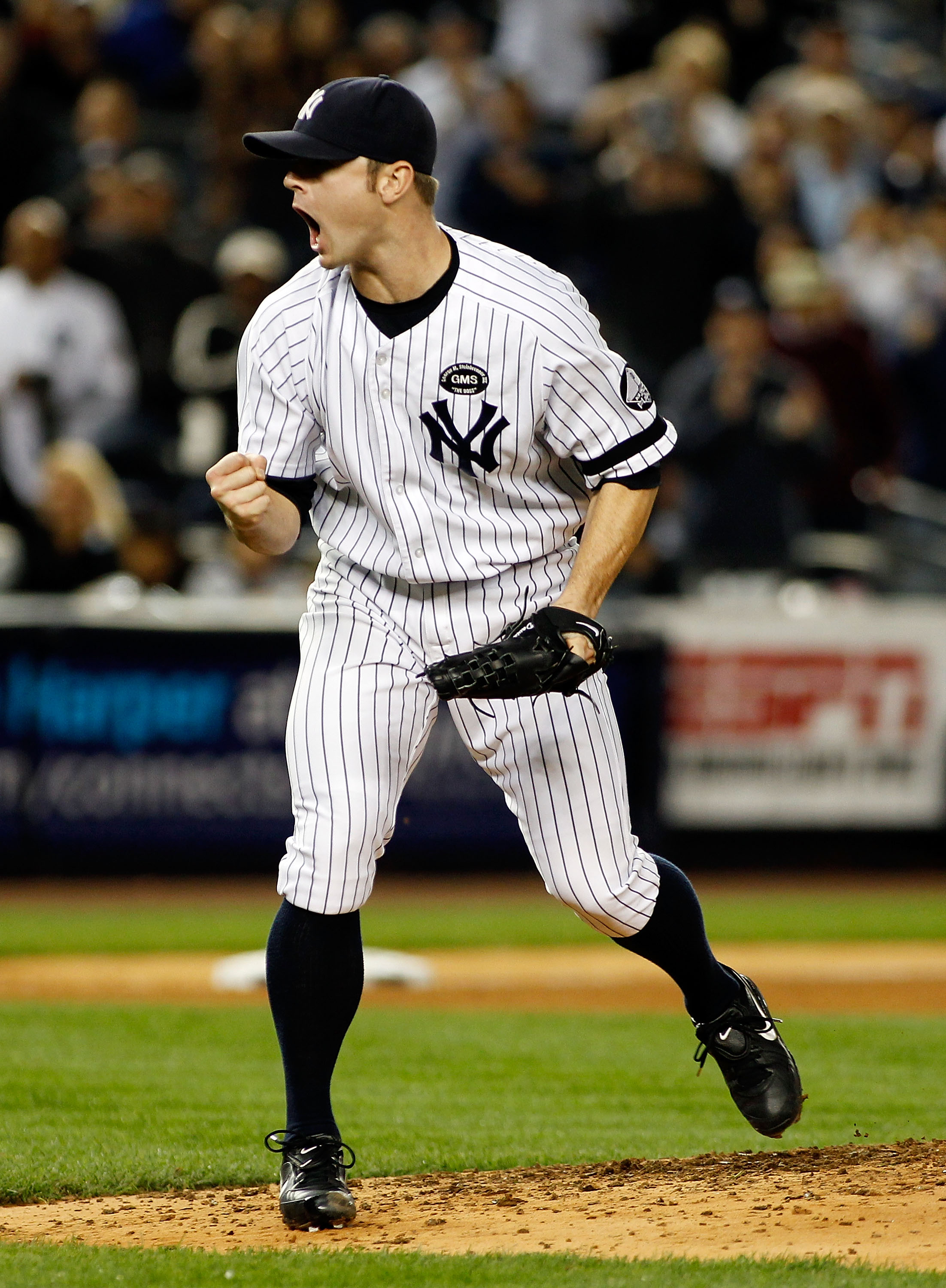 NEW YORK - SEPTEMBER 26:  David Robertson #30 of the New York Yankees pumps his fist after striking out Lars Anderson (not shown) of the Boston Red Sox in the seventh-inning on September 26, 2010 at Yankee Stadium in the Bronx borough of New York City.  (