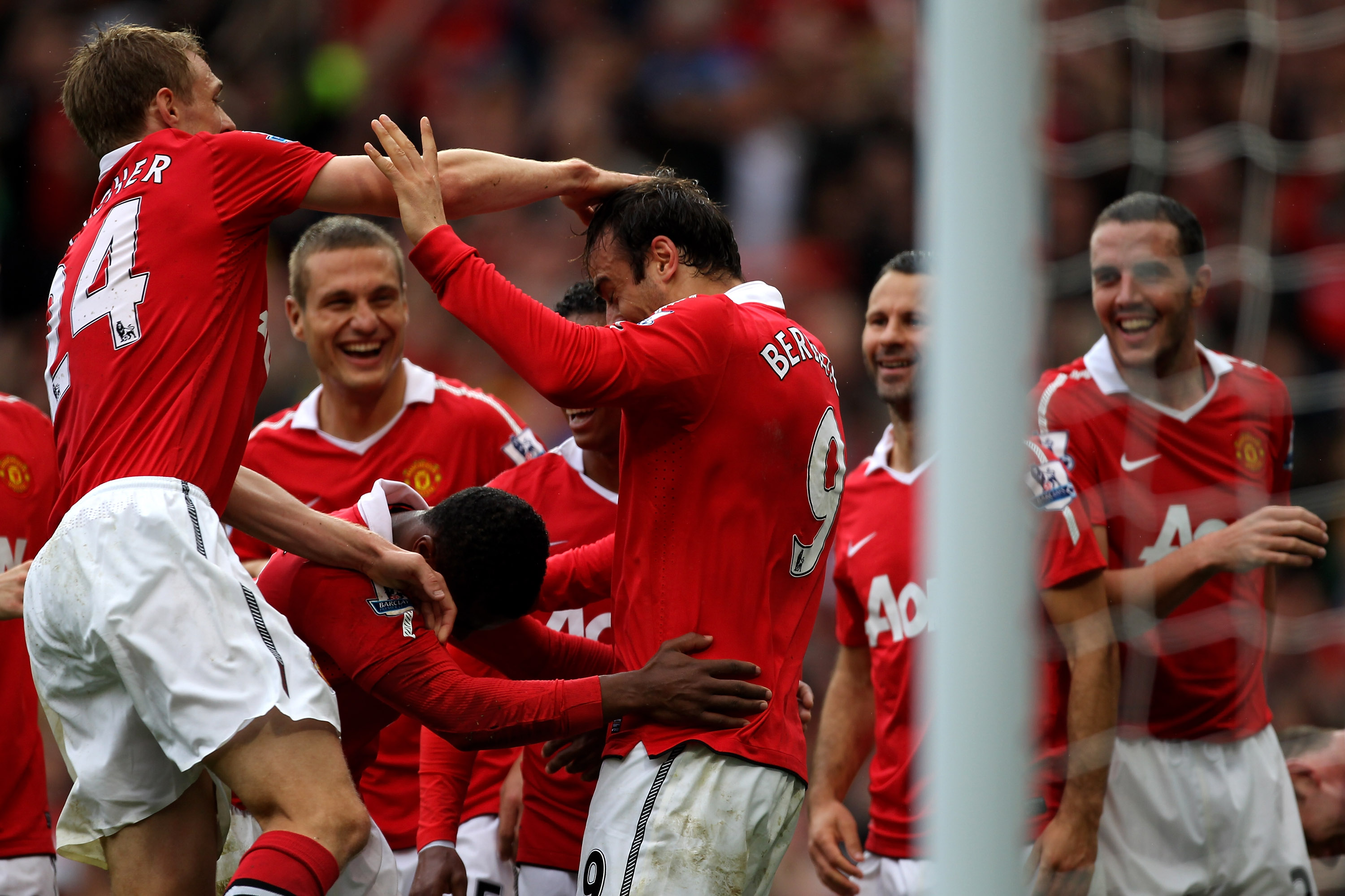 MANCHESTER, ENGLAND - SEPTEMBER 19:  Dimitar Berbatov of Manchester United celebrates scoring his team's second goal with his team mates during the Barclays Premier League match between Manchester United and Liverpool at Old Trafford on September 19, 2010