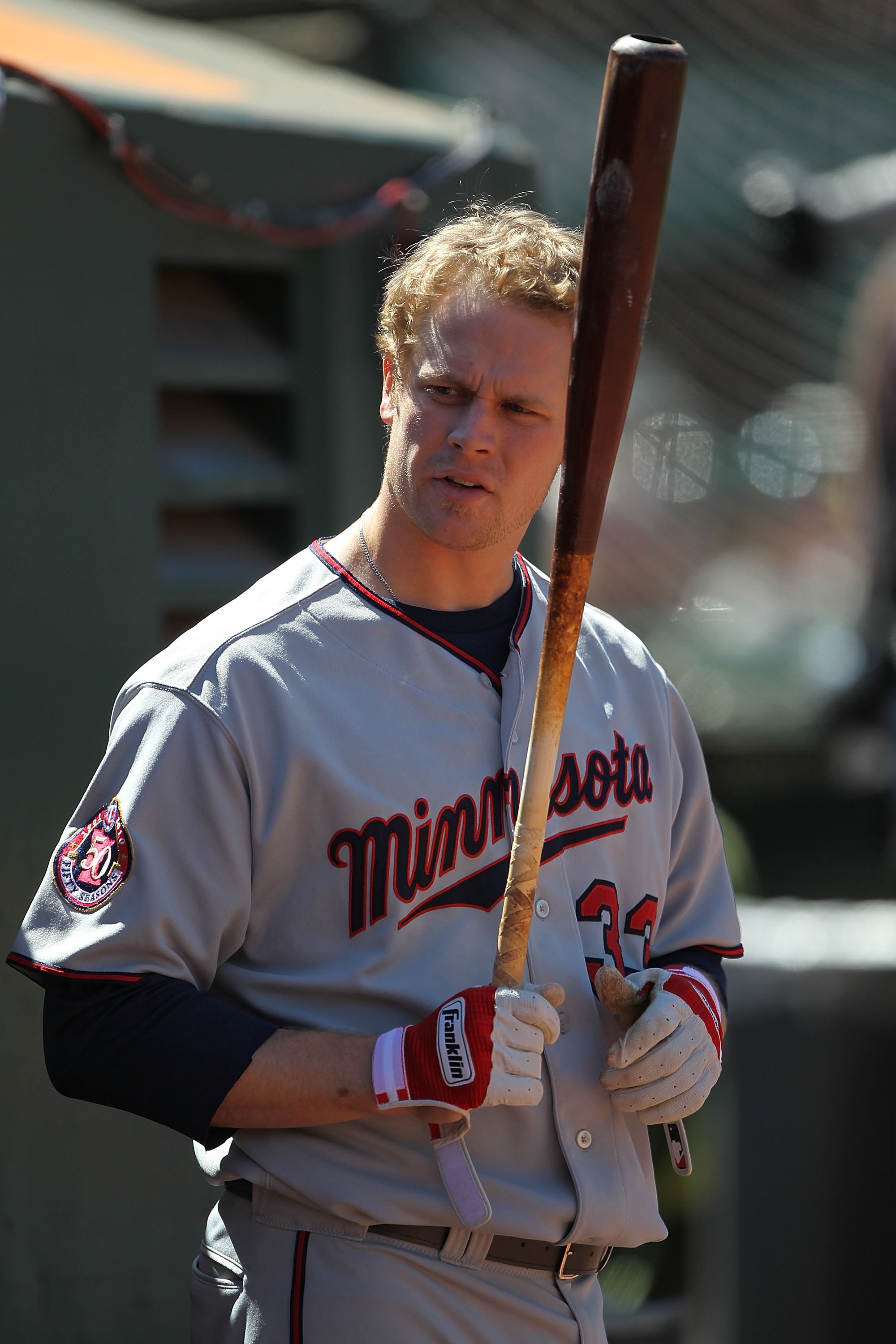 OAKLAND, CA - JUNE 06:  Justin Morneau #33 of the Minnesota Twins prepares to bat against the Oakland Athletics during an MLB game at the Oakland-Alameda County Coliseum on June 6, 2010 in Oakland, California.  (Photo by Jed Jacobsohn/Getty Images)