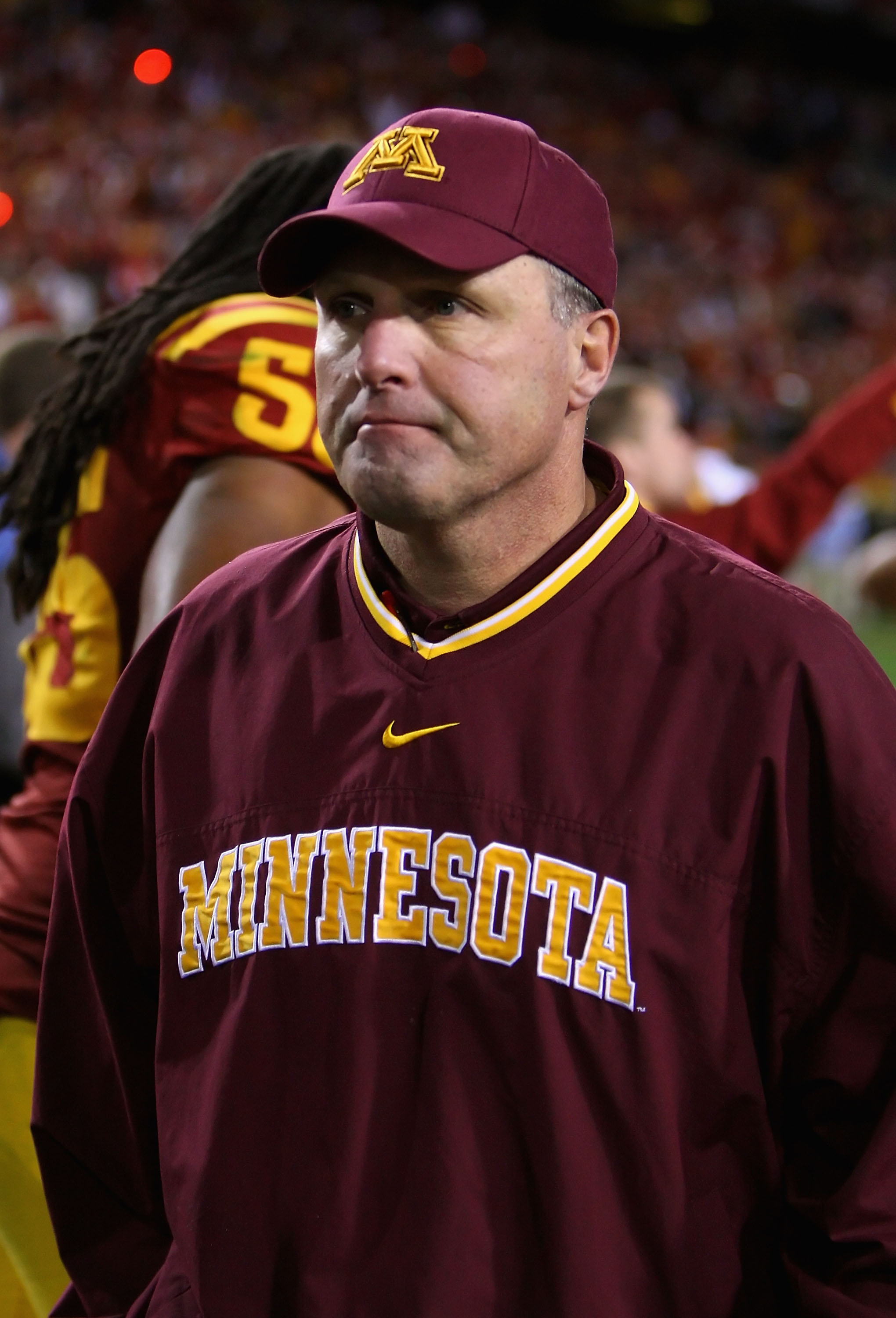 TEMPE, AZ - DECEMBER 31:  Head coach Tim Brewster of the Minnesota Golden Gophers walks off the field after being defeated by the Iowa State Cyclones in the Insight Bowl at Arizona Stadium on December 31, 2009 in Tempe, Arizona. The Cyclones defeated the