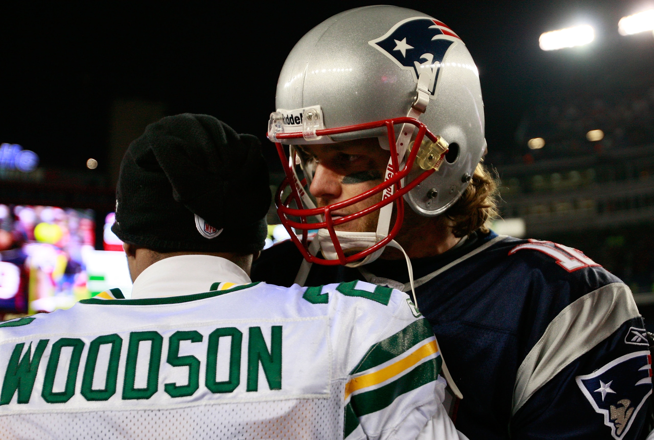 FOXBORO, MA - DECEMBER 19: Quarterback Tom Brady #12 of the New England Patriots is congratulated by cornerback Charles Woodson #21 of the Green Bay Packers at Gillette Stadium on December 19, 2010 in Foxboro, Massachusetts. The Patriots won the game 31- FOXBORO, MA - DECEMBER 19: Quarterback Tom Brady #12 of the New England Patriots is congratulated by cornerback Charles Woodson #21 of the Green Bay Packers at Gillette Stadium on December 19, 2010 in Foxboro, Massachusetts. The Patriots won the game 31-