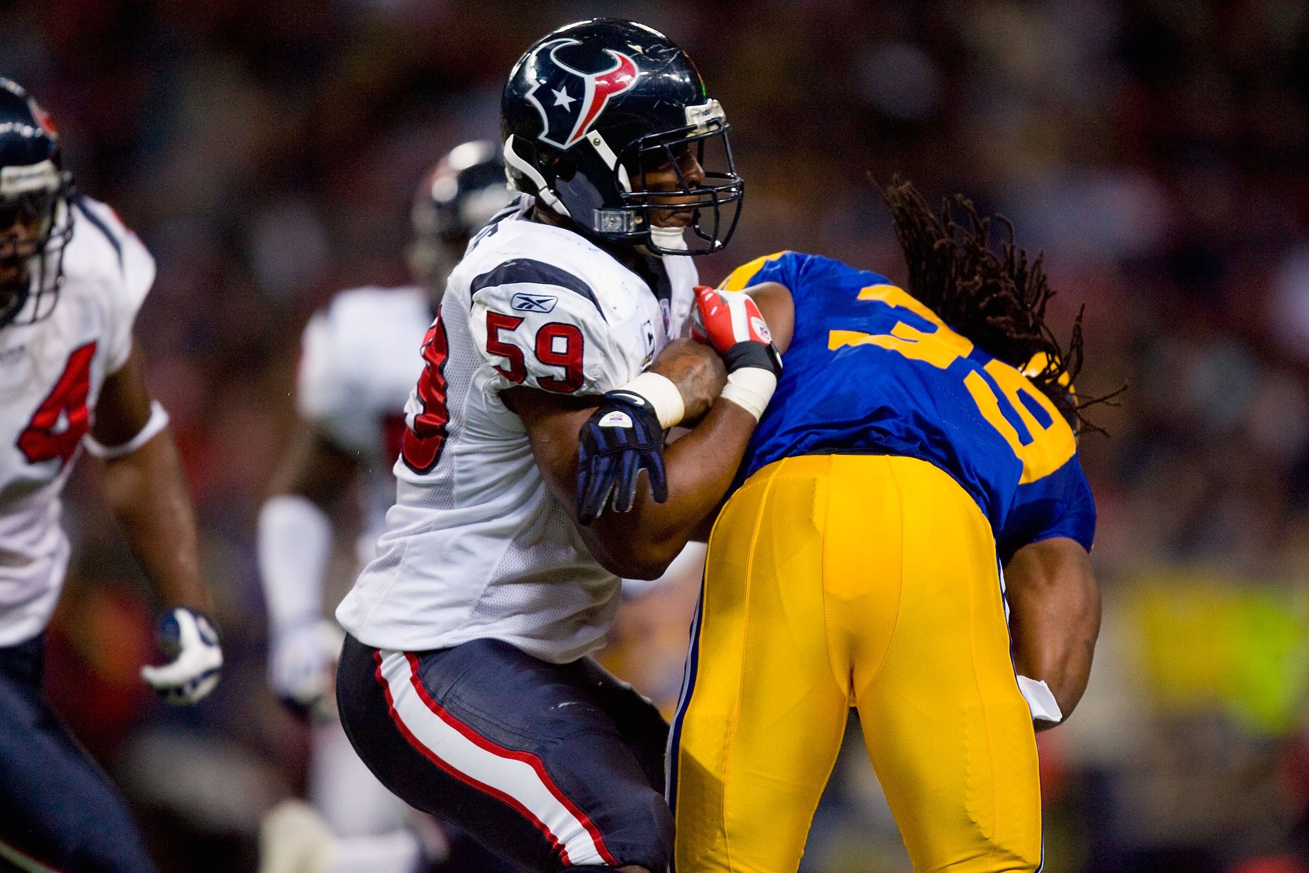 ST. LOUIS - DECEMBER 20: DeMeco Ryans #59 of the Houston Texans tackles Steven Jackson #39 of the St. Louis Rams at Edward Jones Dome on December 20, 2009 in St. Louis, Missouri. (Photo by Dilip Vishwanat/Getty Images) ST. LOUIS - DECEMBER 20: DeMeco Ryans #59 of the Houston Texans tackles Steven Jackson #39 of the St. Louis Rams at Edward Jones Dome on December 20, 2009 in St. Louis, Missouri. (Photo by Dilip Vishwanat/Getty Images)