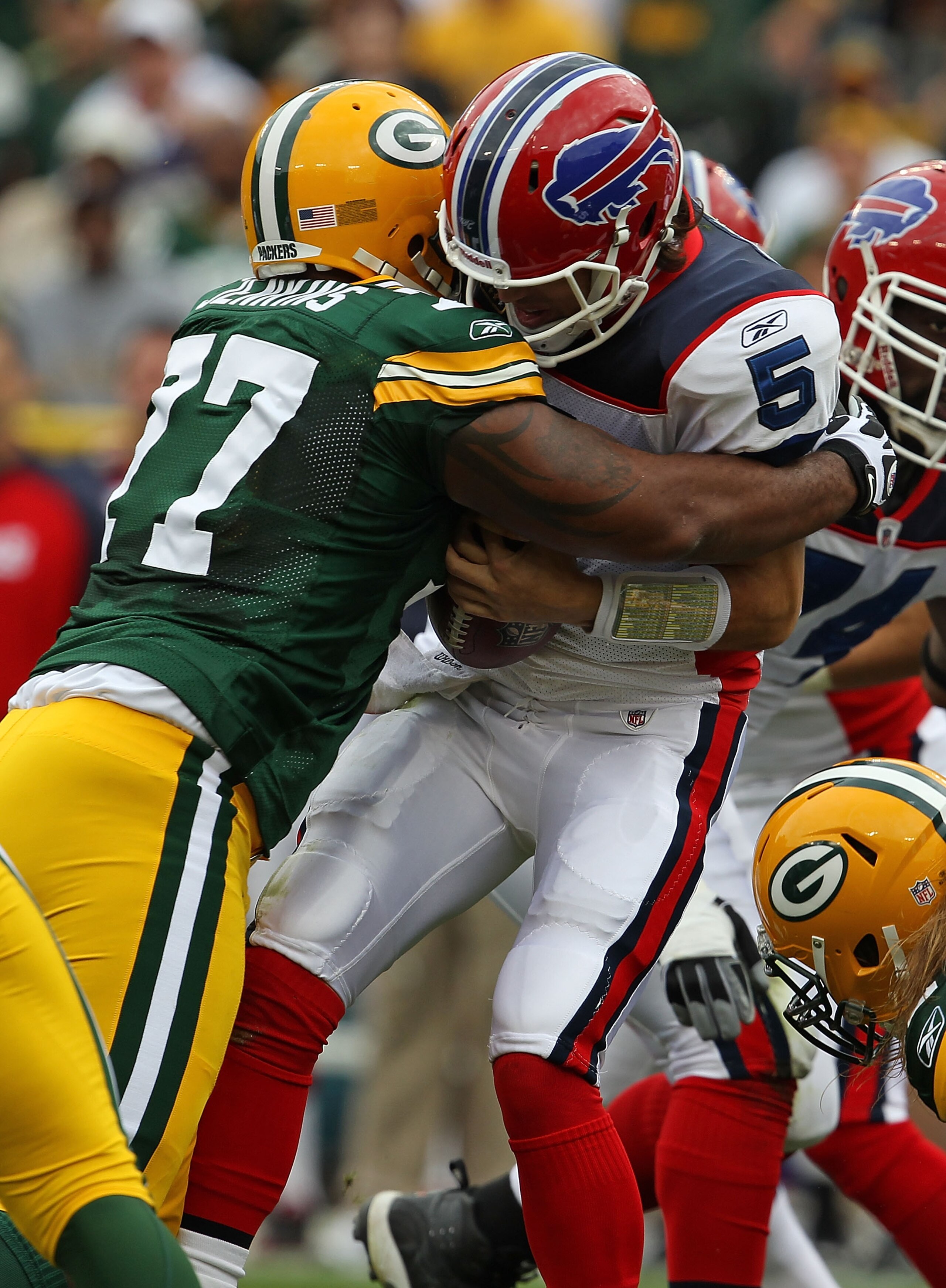 GREEN BAY, WI - SEPTEMBER 19: Cullen Jenkins #77 of the Green Bay Packers sacks Trent Edwards #5 of the Buffalo Bills at Lambeau Field on September 19, 2010 in Green Bay, Wisconsin. The Packers defeated the Bills 34-7. (Photo by Jonathan Daniel/Getty Imag GREEN BAY, WI - SEPTEMBER 19: Cullen Jenkins #77 of the Green Bay Packers sacks Trent Edwards #5 of the Buffalo Bills at Lambeau Field on September 19, 2010 in Green Bay, Wisconsin. The Packers defeated the Bills 34-7. (Photo by Jonathan Daniel/Getty Imag