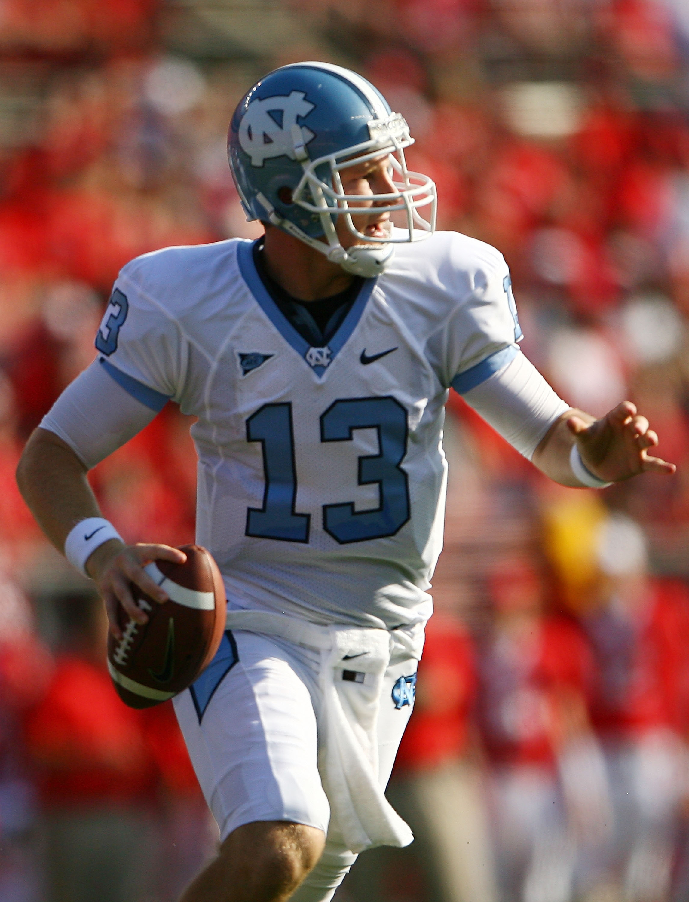 NEW BRUNSWICK, NJ - SEPTEMBER 25:  T.J. Yates #13 of the North Carolina Tar Heels drops back against the Rutgers Scarlet Knights at Rutgers Stadium on September 25, 2010 in New Brunswick, New Jersey.  (Photo by Andrew Burton/Getty Images)