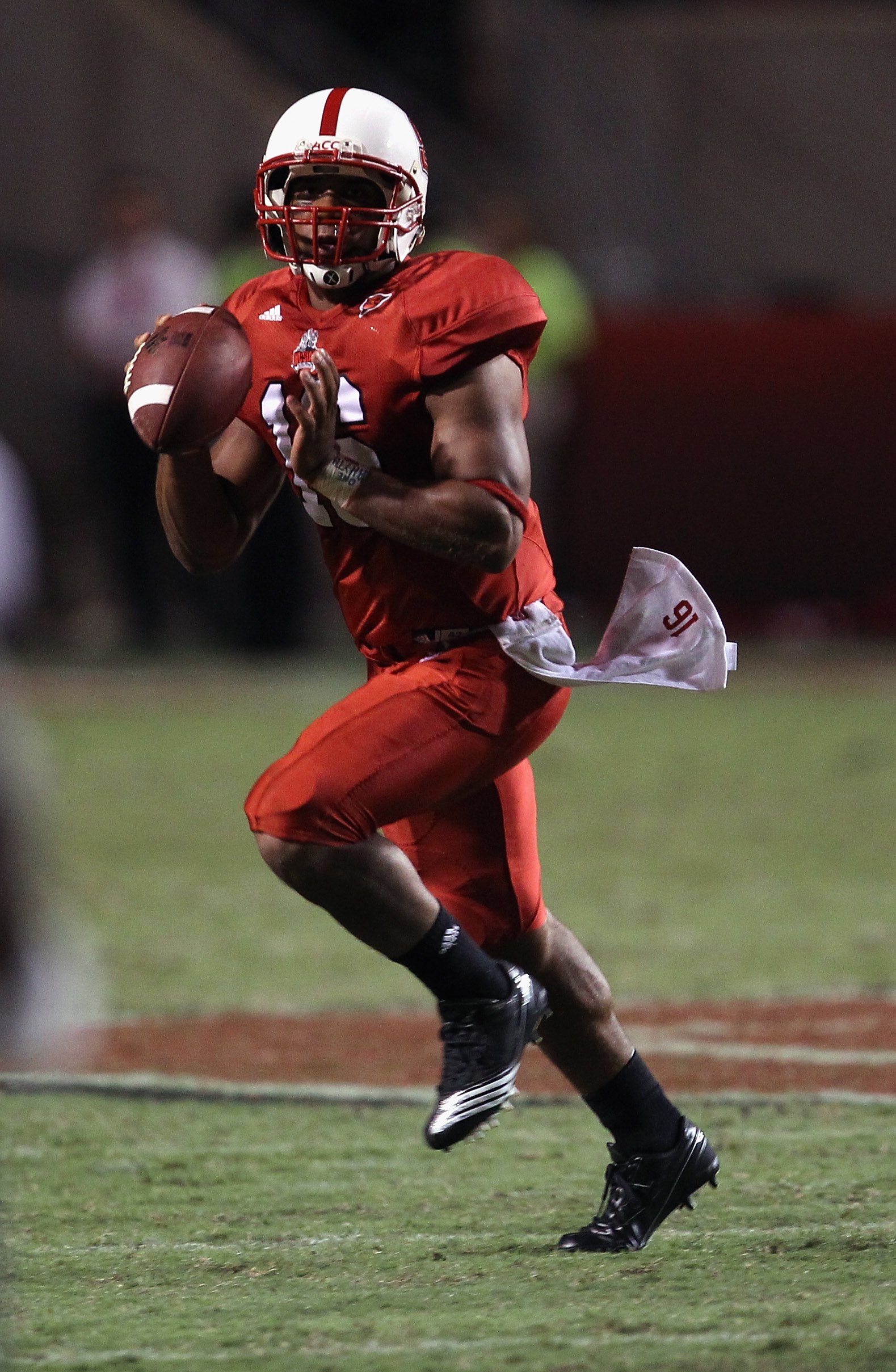 RALEIGH, NC - SEPTEMBER 16:  Russell Wilson #16 of the North Carolina State Wolfpack runs with the ball against the Cincinnati Bearcats during their game at Carter-Finley Stadium on September 16, 2010 in Raleigh, North Carolina.  (Photo by Streeter Lecka/